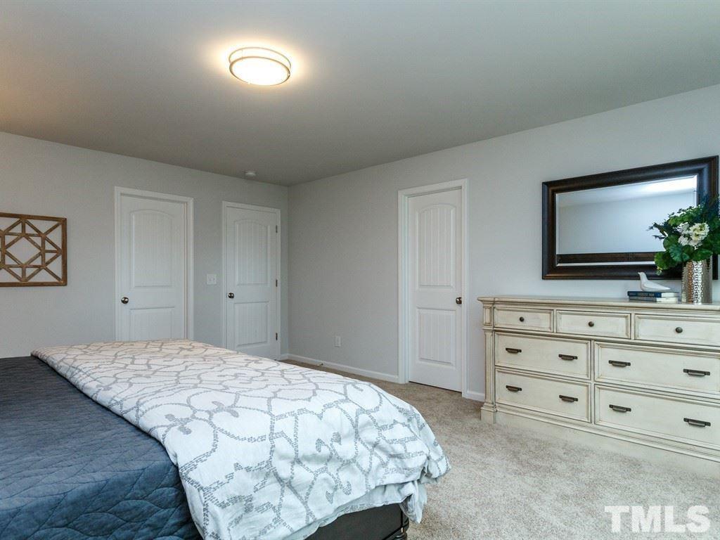 3340 Tracer Drive Graham, NC 27253 - Photo 18 of 23 a bedroom with a bed and a mirror on dresser