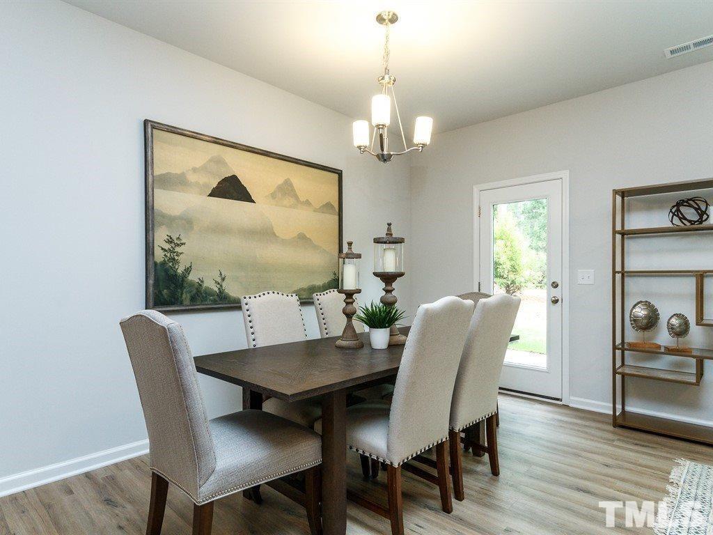 3340 Tracer Drive Graham, NC 27253 - Photo 9 of 23 a view of a dining room with furniture window and wooden floor