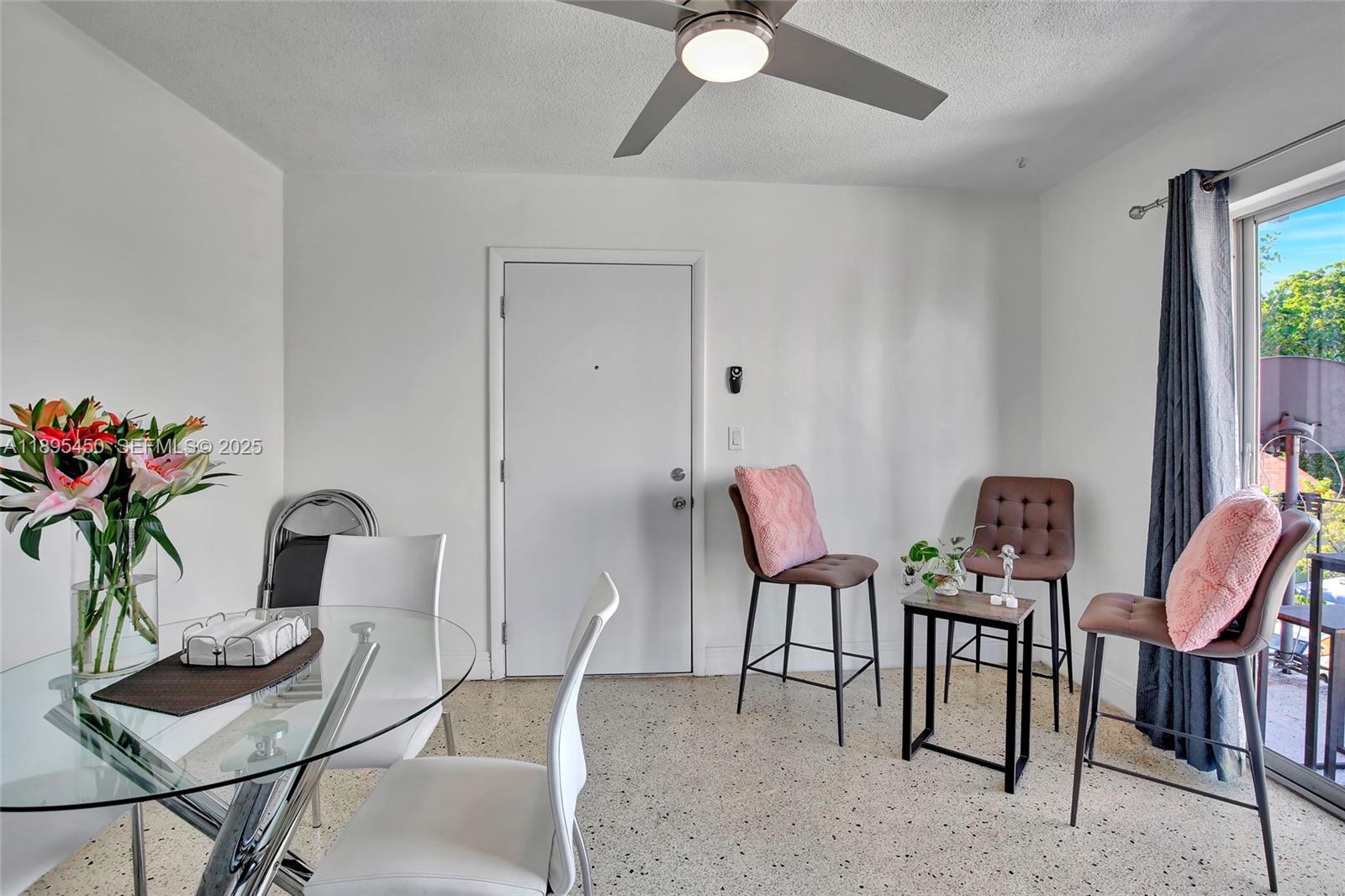 458 Southwest 9th Street, Unit 8 Miami, FL 33130 - Photo 2 of 22 a dining room with furniture and a potted plant