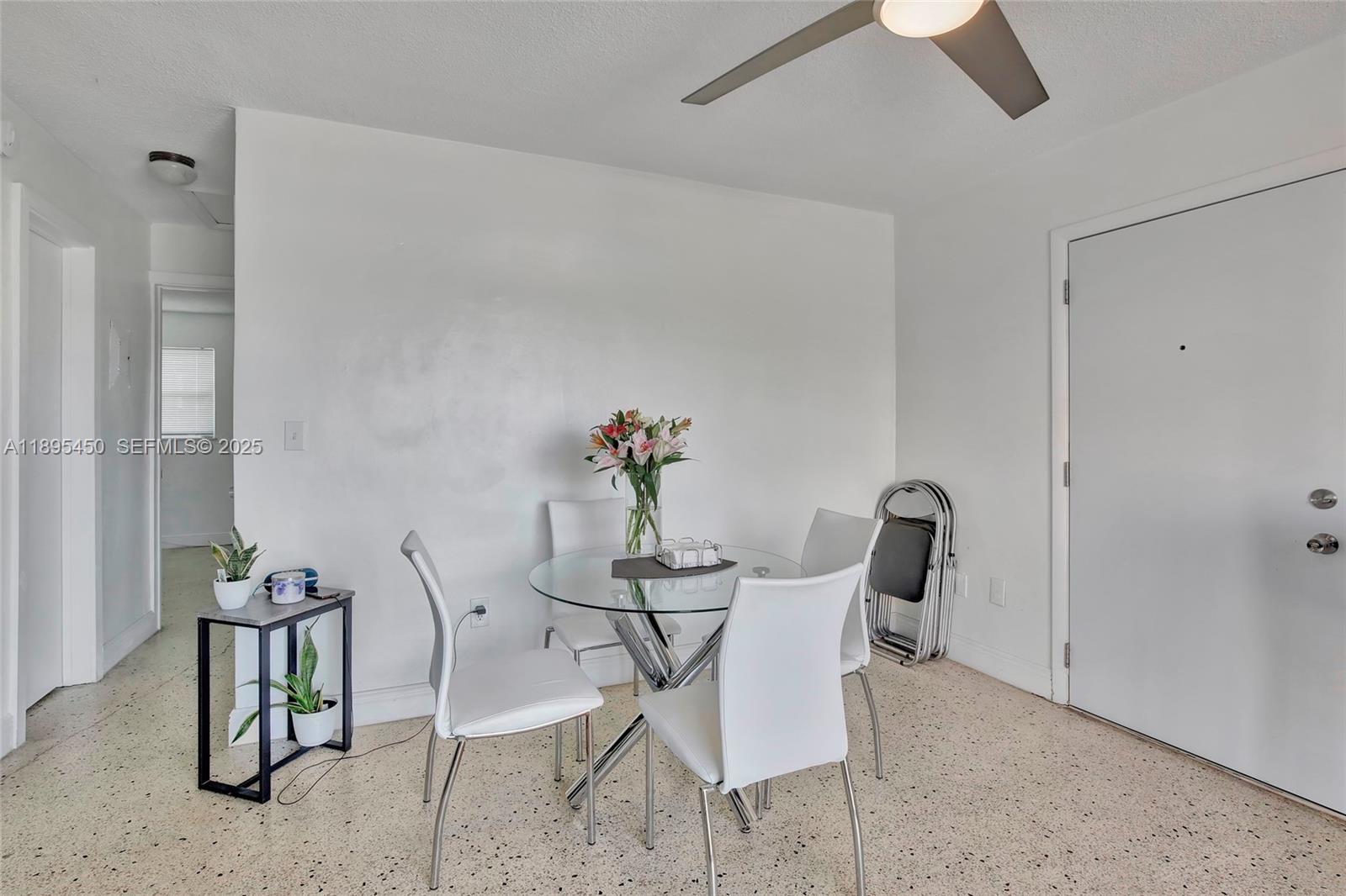 458 Southwest 9th Street, Unit 8 Miami, FL 33130 - Photo 3 of 22 a dining room with furniture and potted plants