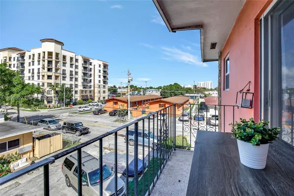 a view of balcony with furniture