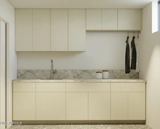 a kitchen with stainless steel appliances granite countertop a sink and cabinets