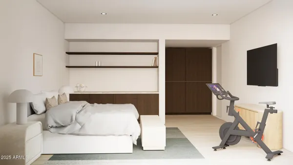 a bed room with a bed and a chair