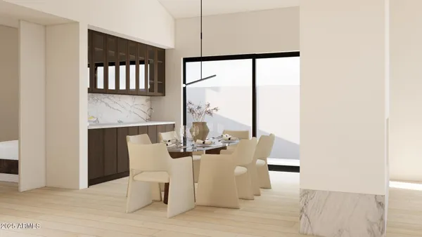 a living room with couches lamp and dining room view