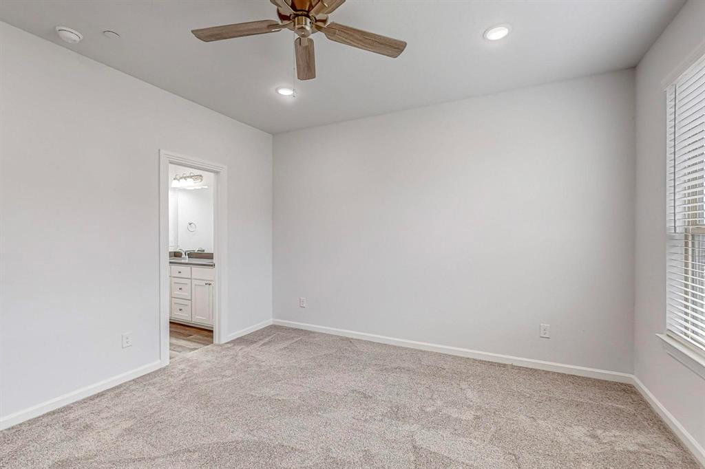 265 Buck Ridge Drive Frisco, TX 75068 - Photo 21 of 40 an empty room with a window and a fan