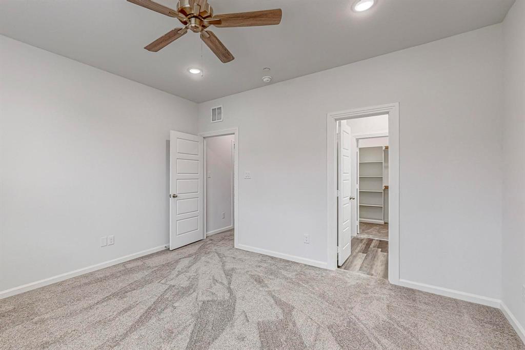 265 Buck Ridge Drive Frisco, TX 75068 - Photo 22 of 40 an empty room with closet and a ceiling fan