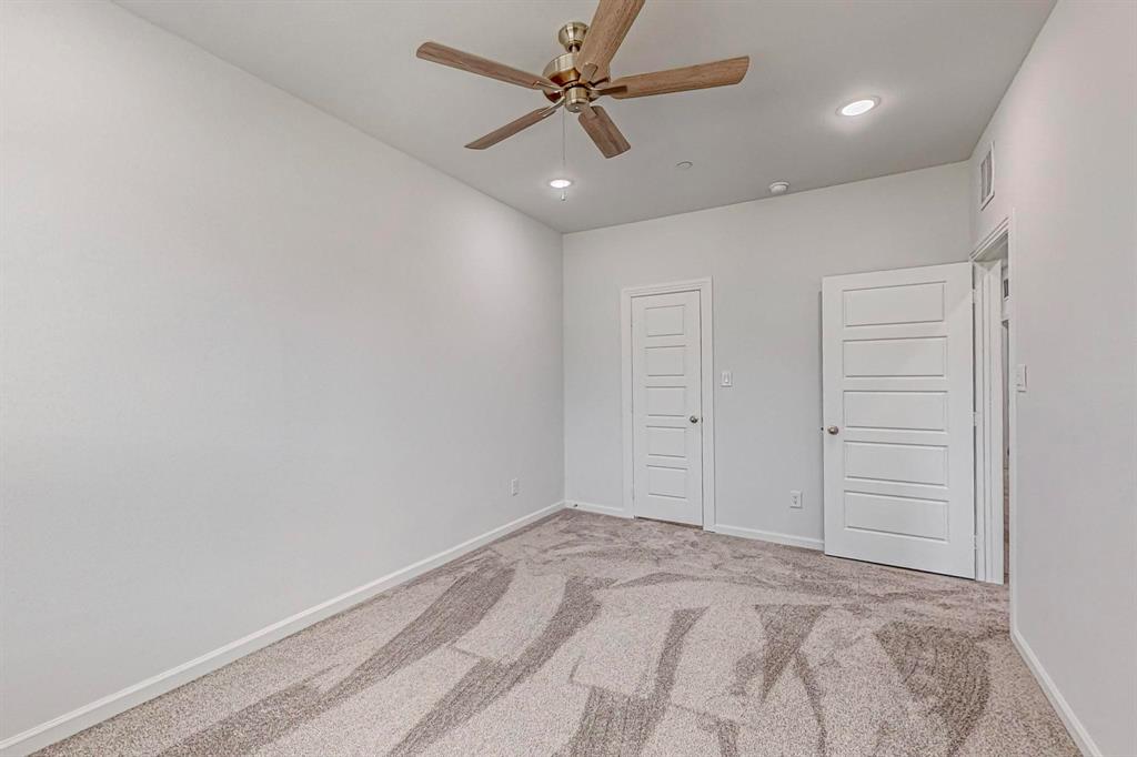 265 Buck Ridge Drive Frisco, TX 75068 - Photo 27 of 40 an empty room with closet and a ceiling fan