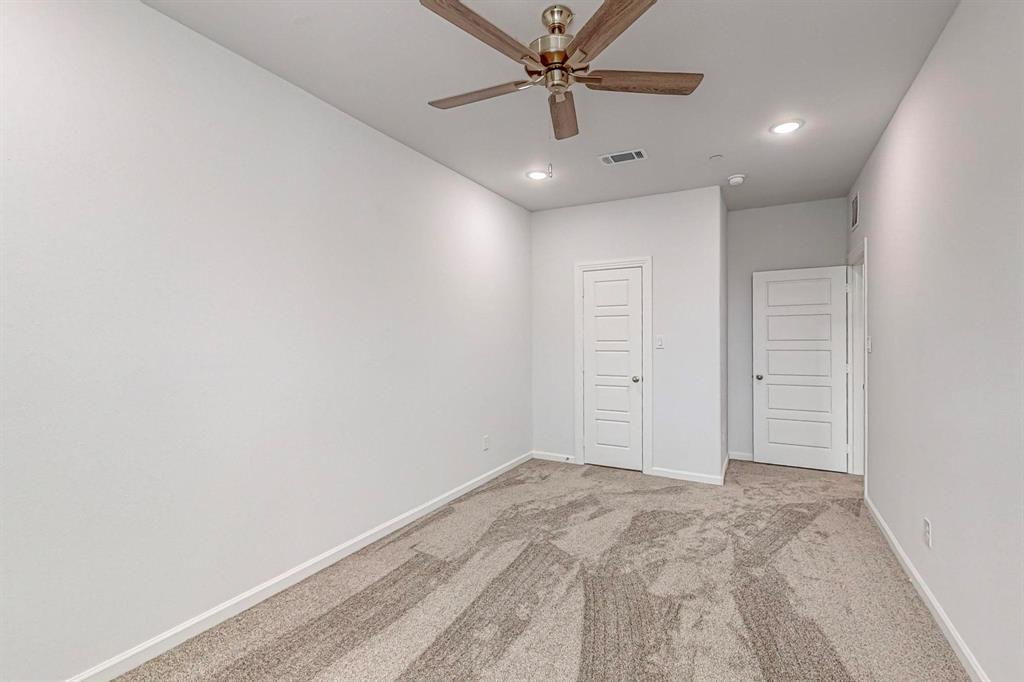 265 Buck Ridge Drive Frisco, TX 75068 - Photo 31 of 40 an empty room with a ceiling fan