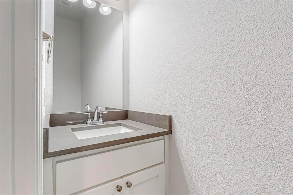 265 Buck Ridge Drive Frisco, TX 75068 - Photo 36 of 40 a bathroom with a sink and vanity