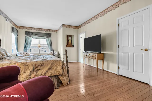a living room with furniture flat screen tv and a fireplace