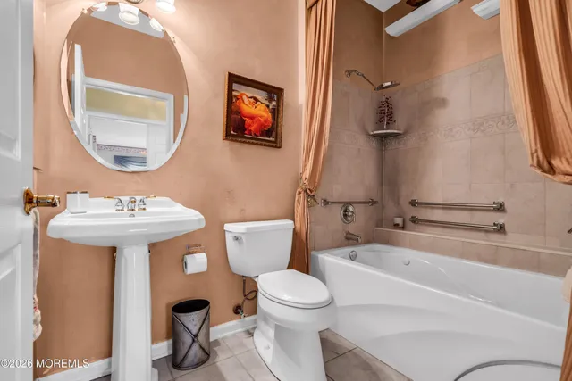 a bathroom with a sink toilet and a bathtub