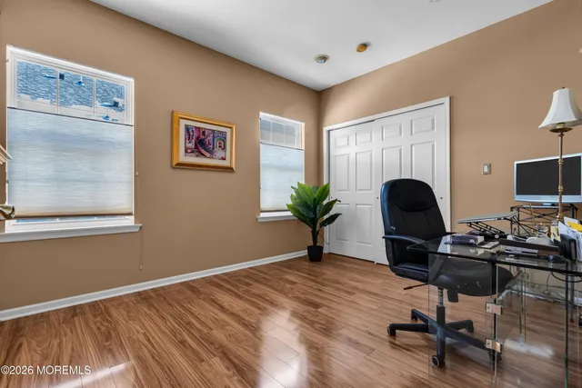 a workspace with furniture and a potted plant