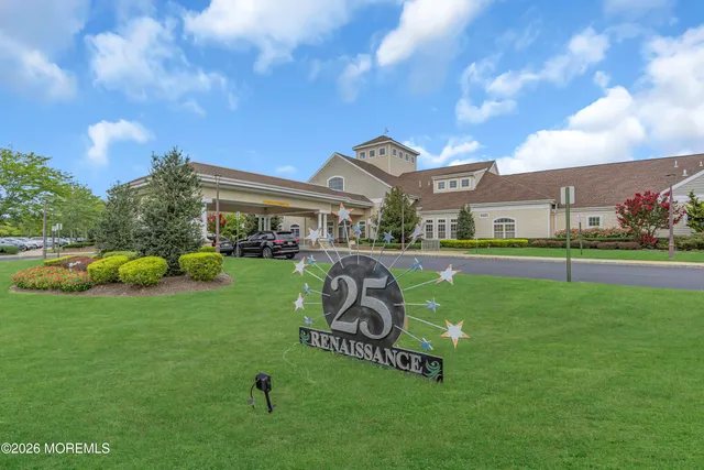 a view of a garden and front of house