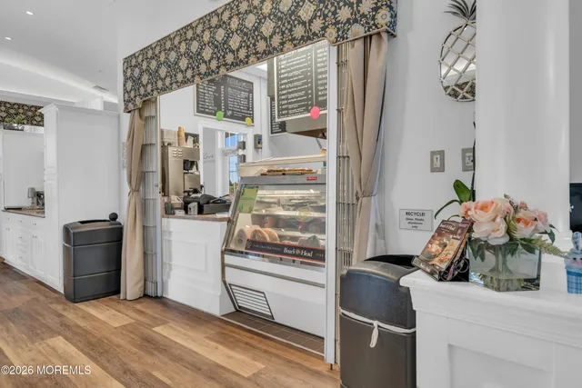 a kitchen with a refrigerator and stove top oven