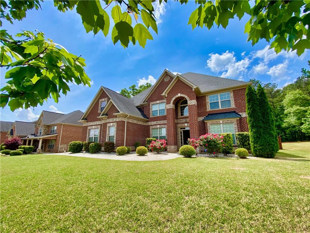 301 Snow Bird Drive Hampton, GA 30228 - Photo 1 of 1 a front view of a house with a yard