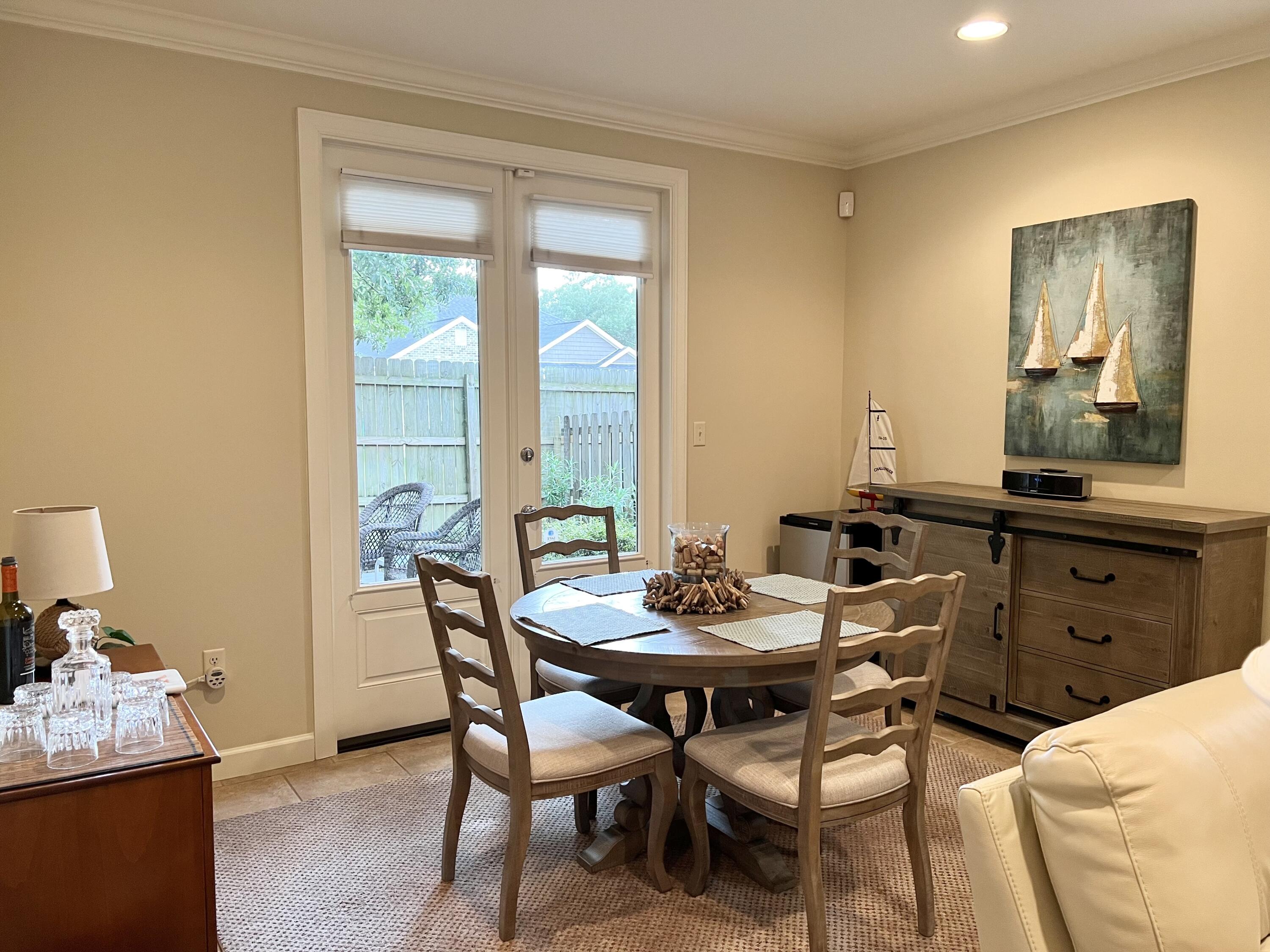 4248 Skipjack Cove Niceville, FL 32578 - Photo 13 of 64 a dining room with furniture and window