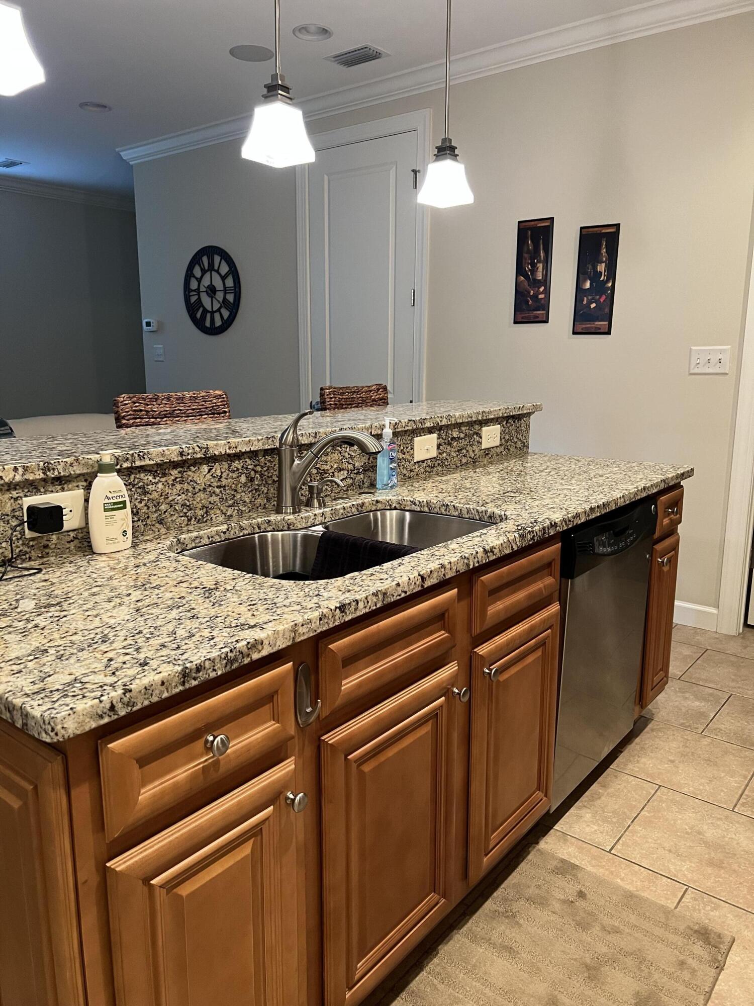 4248 Skipjack Cove Niceville, FL 32578 - Photo 17 of 64 a bathroom with a granite countertop sink and a mirror