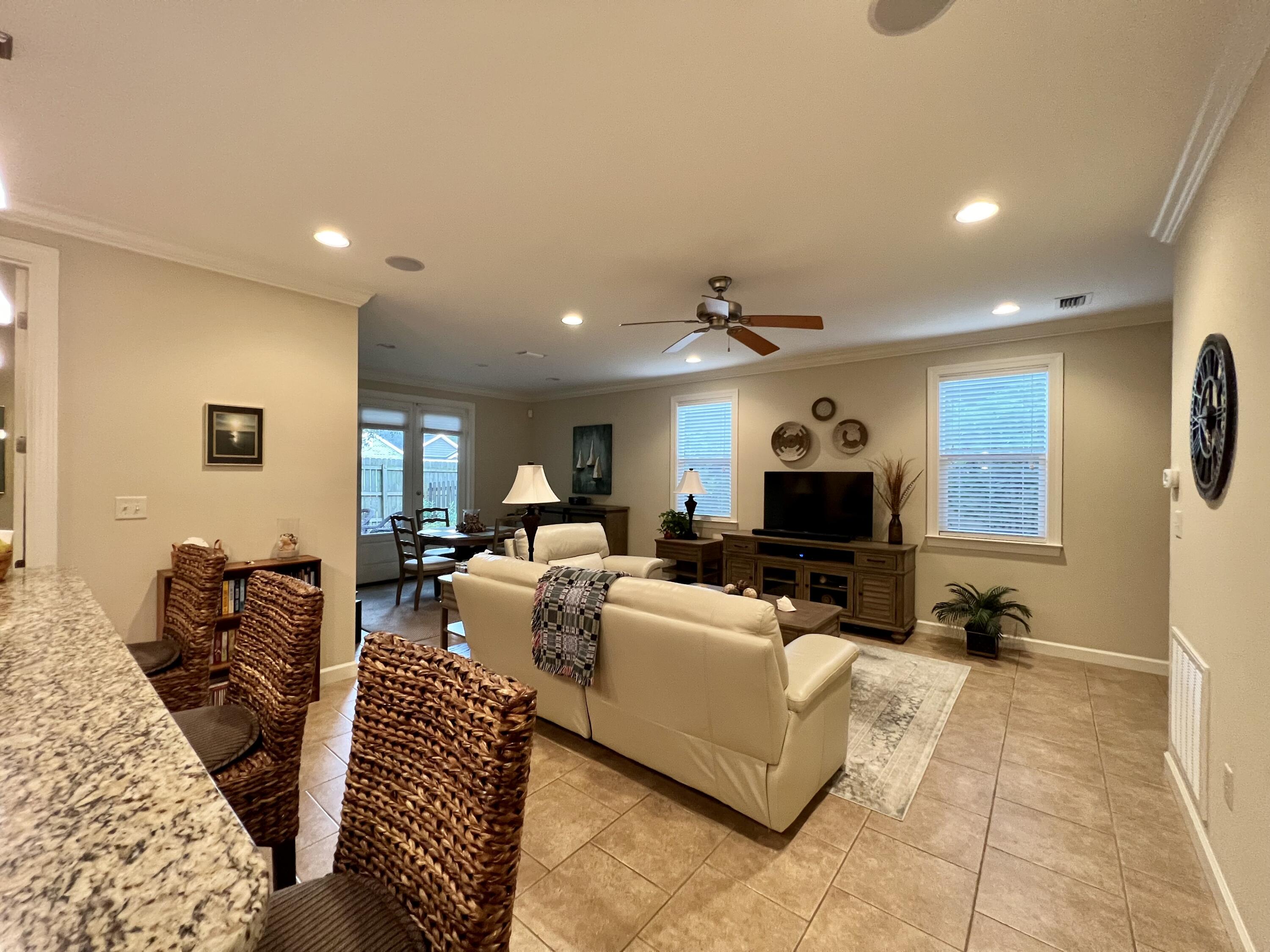 4248 Skipjack Cove Niceville, FL 32578 - Photo 24 of 64 a living room with furniture and a flat screen tv