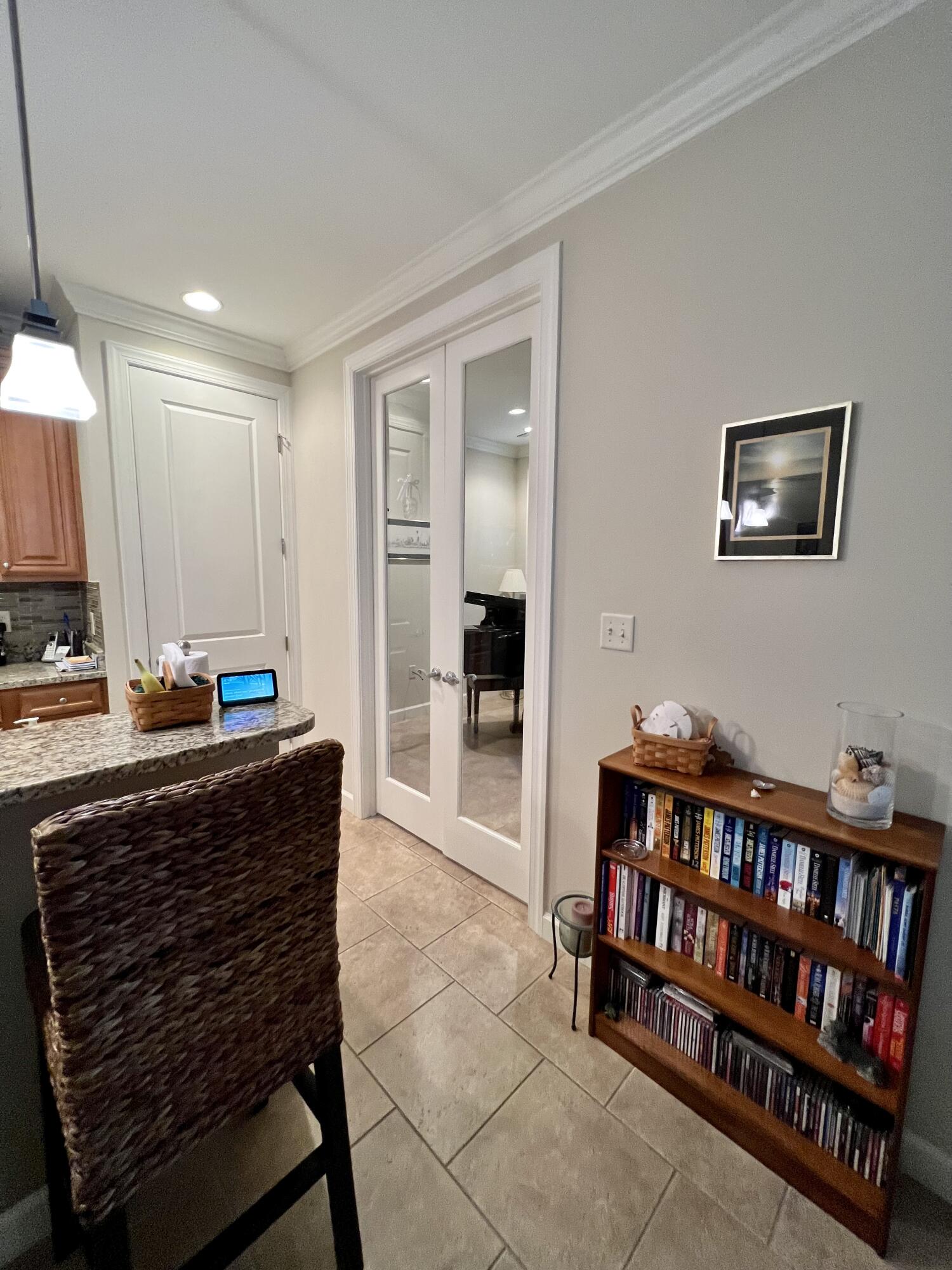 4248 Skipjack Cove Niceville, FL 32578 - Photo 28 of 64 a living room with furniture and a book shelf