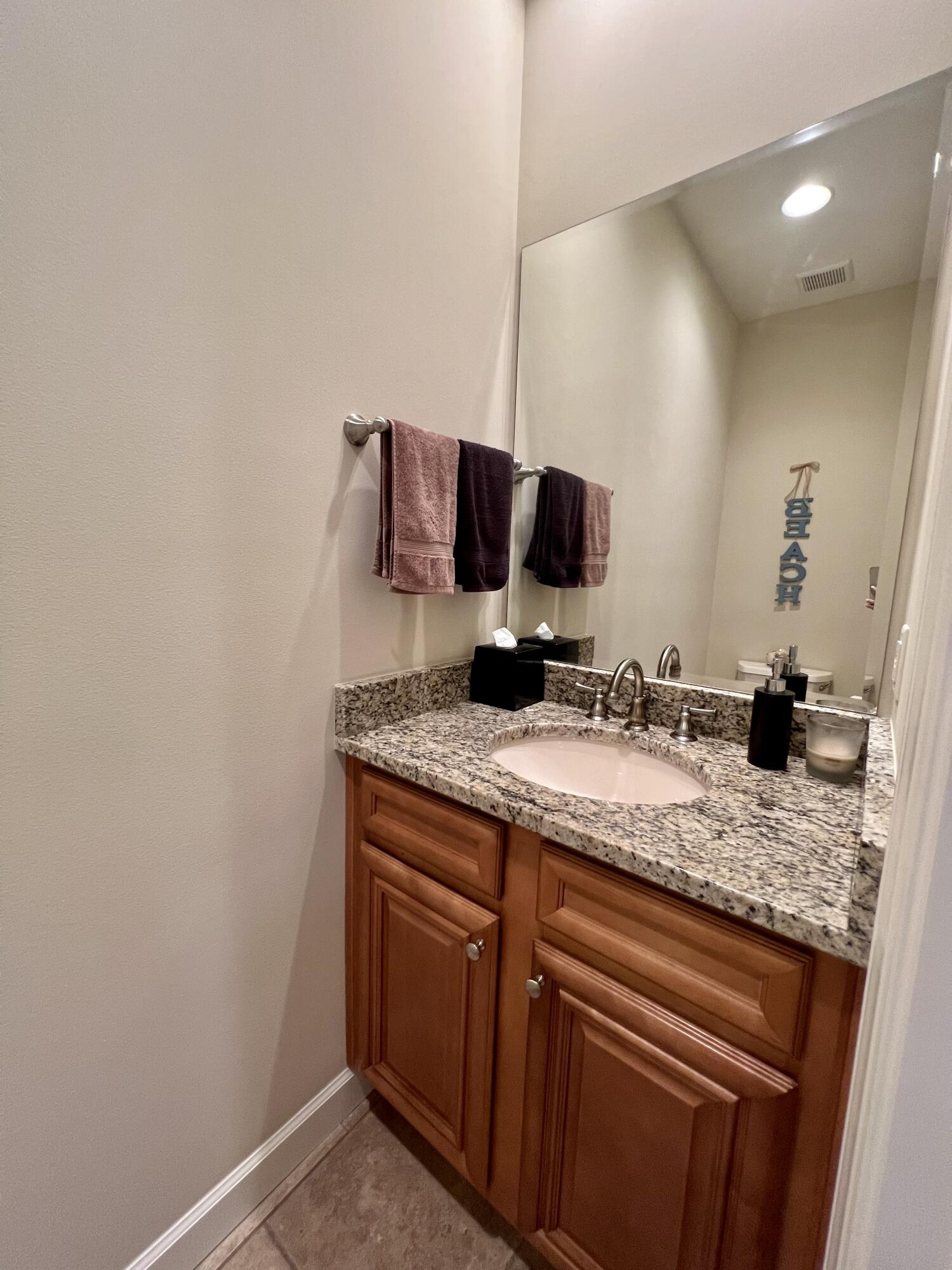 4248 Skipjack Cove Niceville, FL 32578 - Photo 32 of 64 a kitchen with a granite countertop sink and a mirror