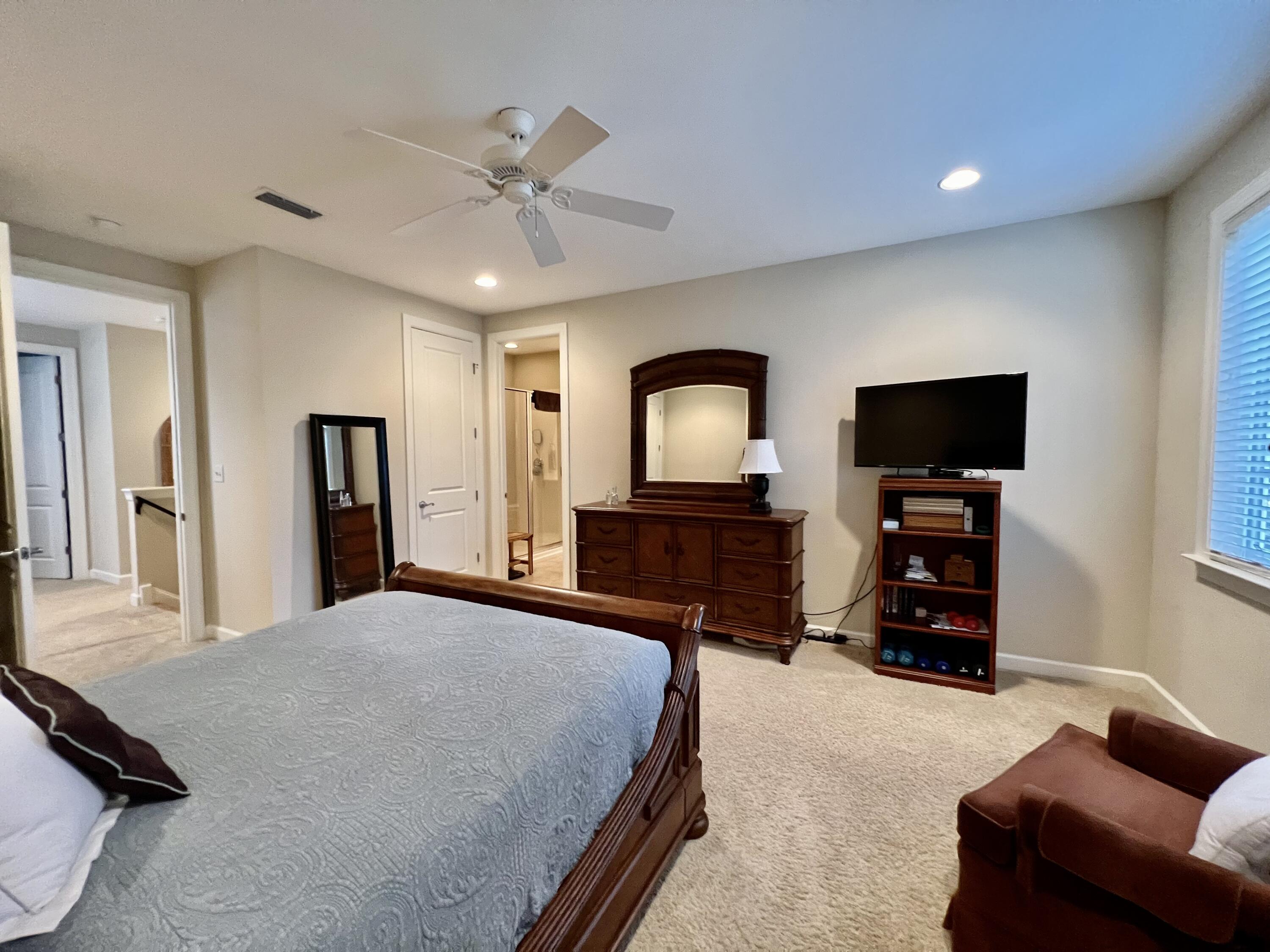 4248 Skipjack Cove Niceville, FL 32578 - Photo 38 of 64 a bedroom with a bed and a flat screen tv