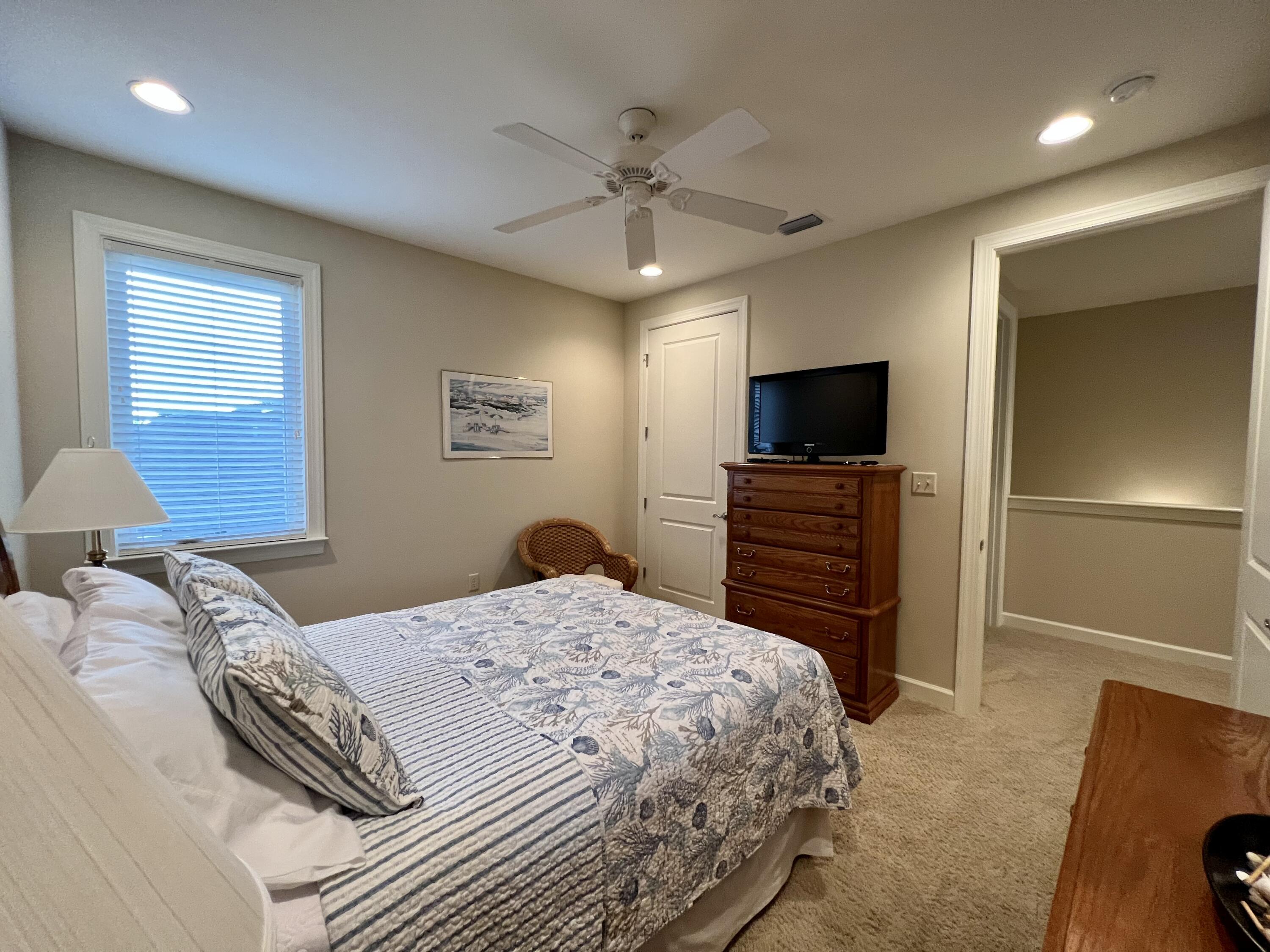 4248 Skipjack Cove Niceville, FL 32578 - Photo 51 of 64 a bedroom with a bed and a flat screen tv