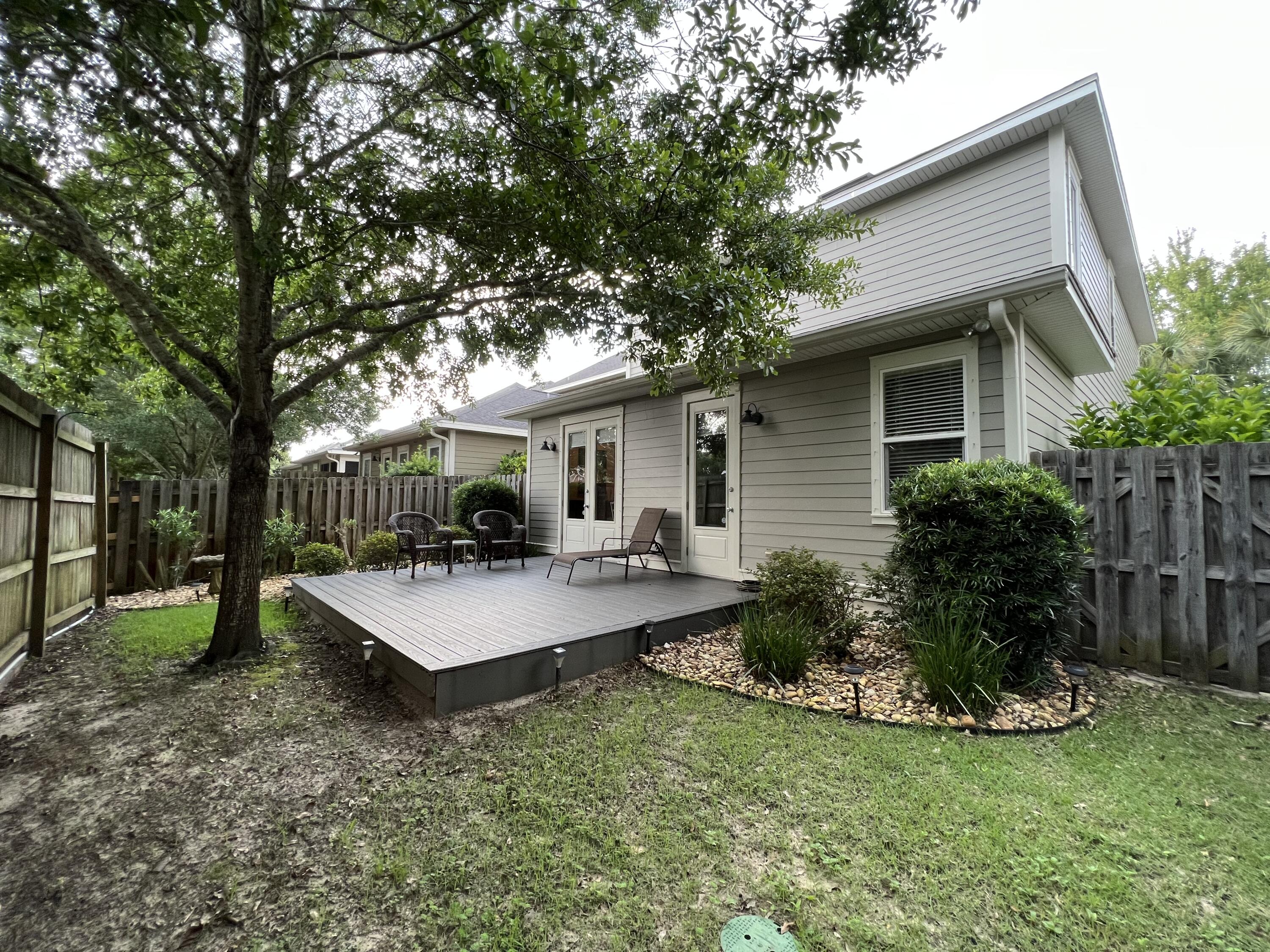 4248 Skipjack Cove Niceville, FL 32578 - Photo 59 of 64 a view of house with backyard and garden