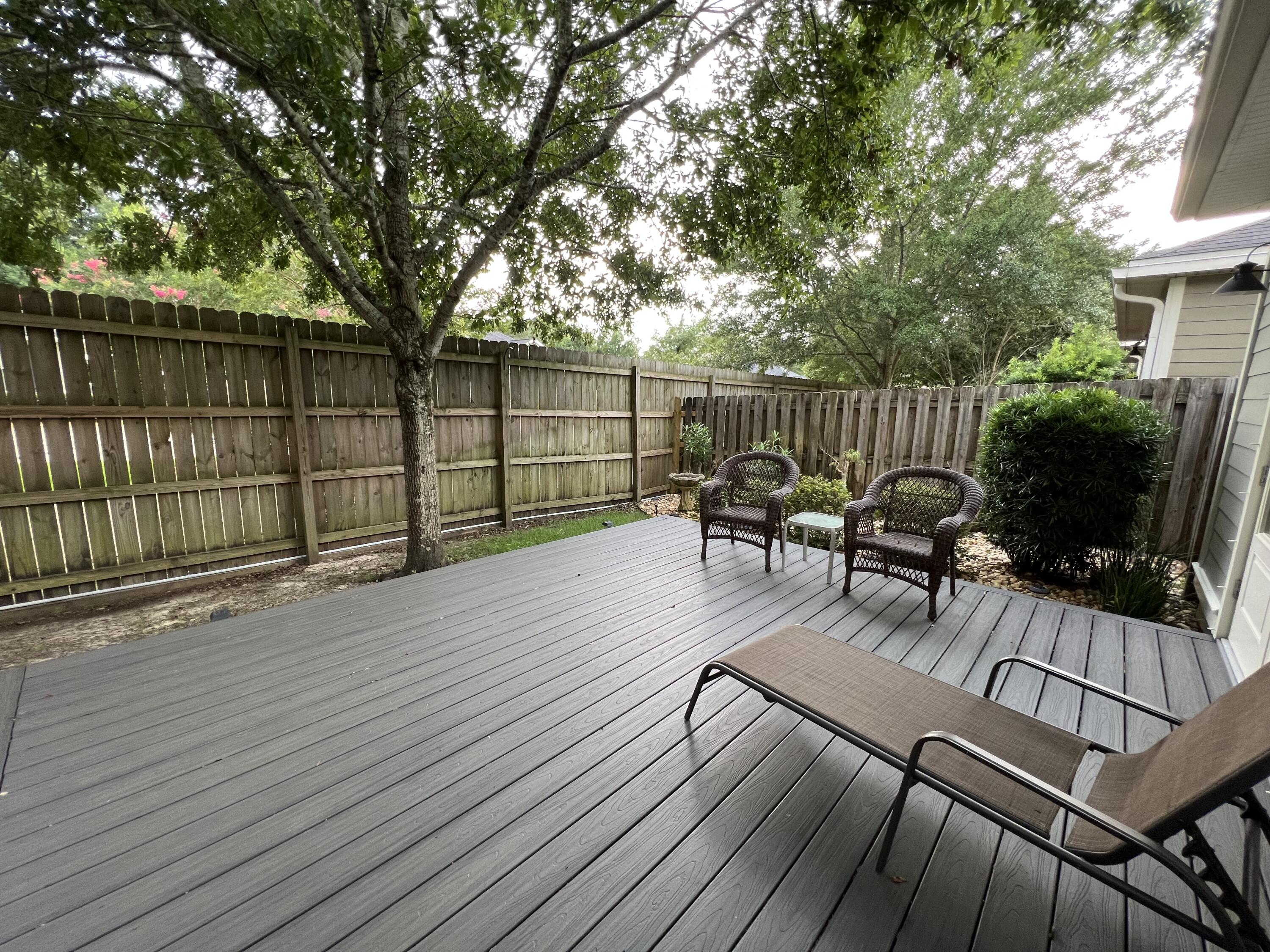 4248 Skipjack Cove Niceville, FL 32578 - Photo 62 of 64 a view of a deck with furniture and wooden floor