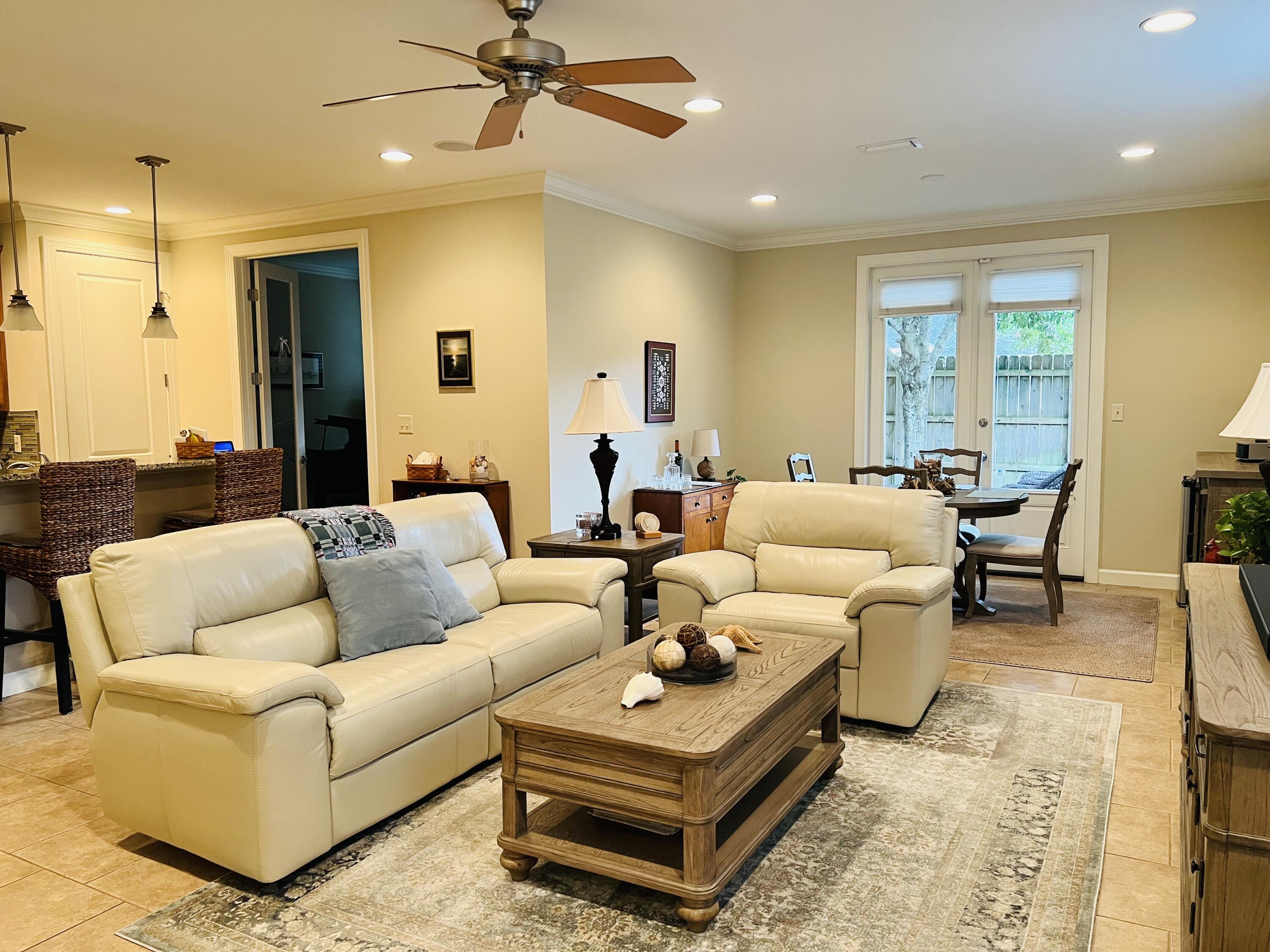 4248 Skipjack Cove Niceville, FL 32578 - Photo 10 of 64 a living room with furniture a rug and a window