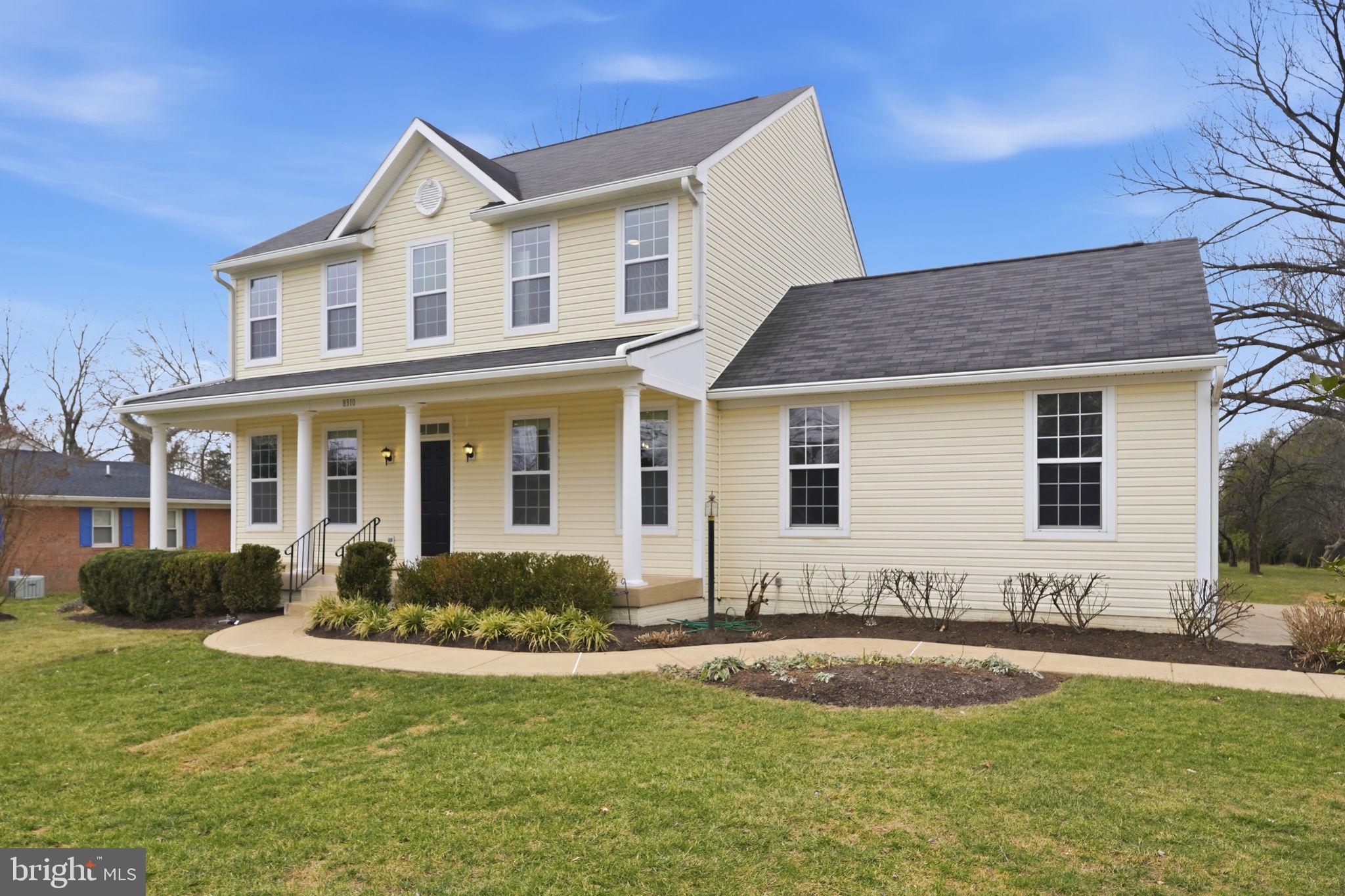 8310 Rolling Road Manassas, VA 20110 - Photo 1 of 58 a front view of a house with a yard
