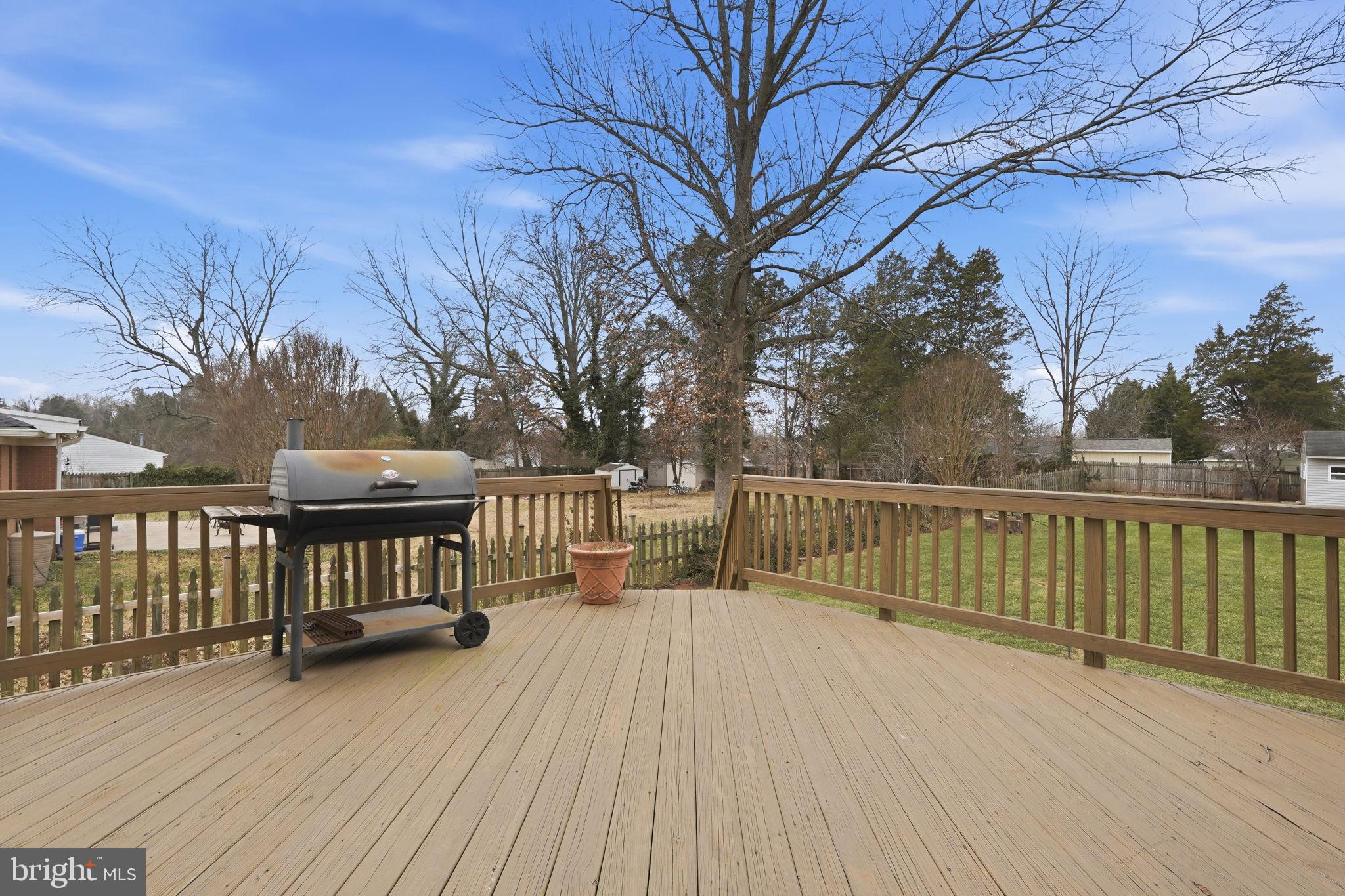 8310 Rolling Road Manassas, VA 20110 - Photo 12 of 58 a view of balcony with wooden floor and fence