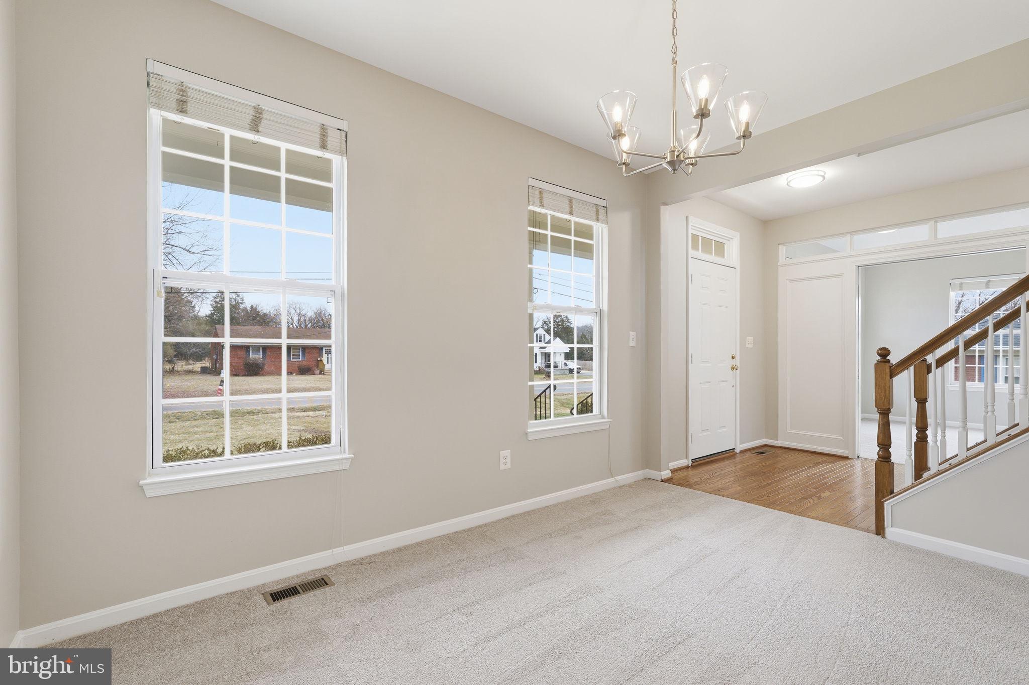 8310 Rolling Road Manassas, VA 20110 - Photo 14 of 58 a view of an empty room with a window