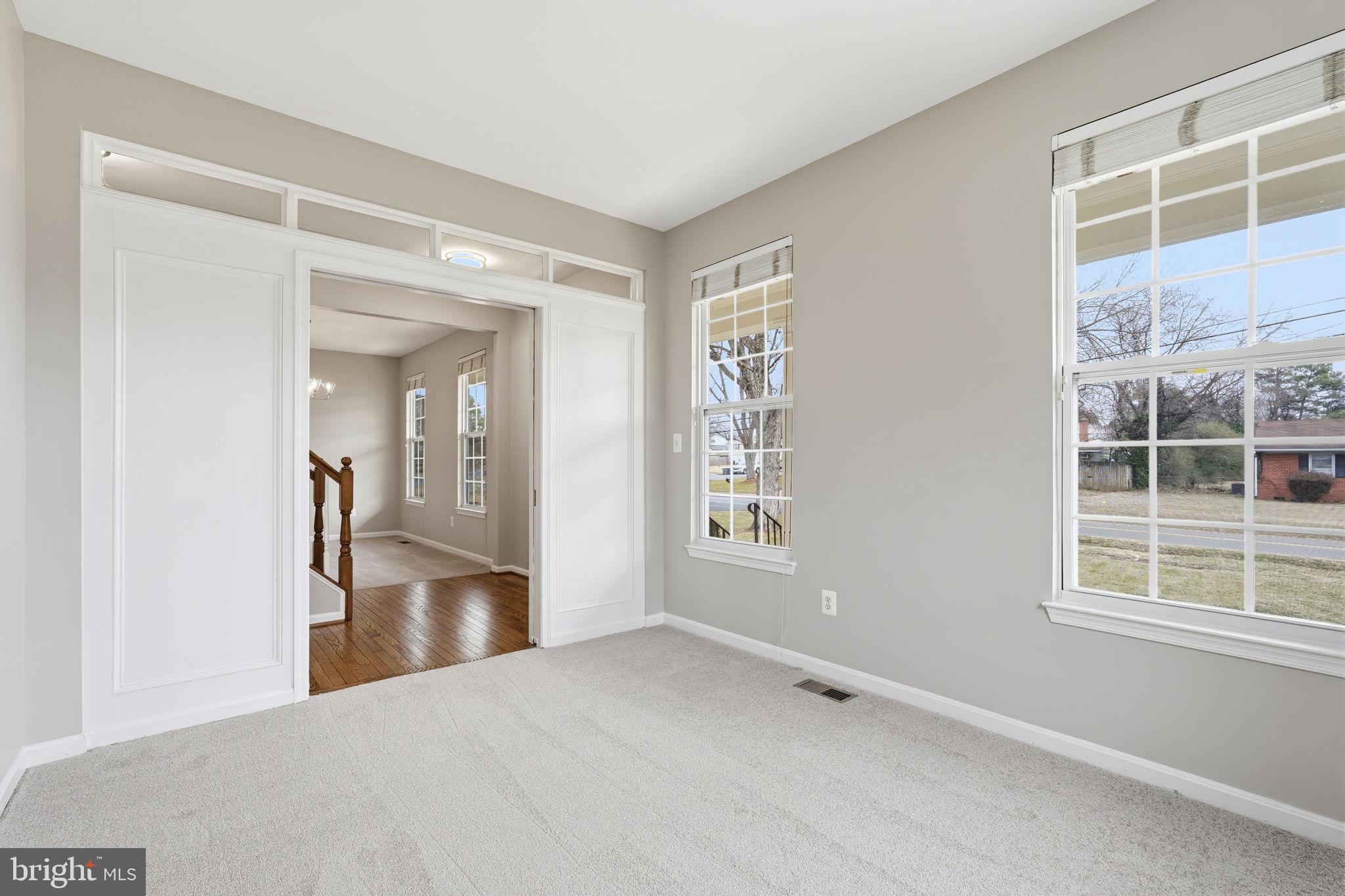 8310 Rolling Road Manassas, VA 20110 - Photo 15 of 58 a view of empty room with windows