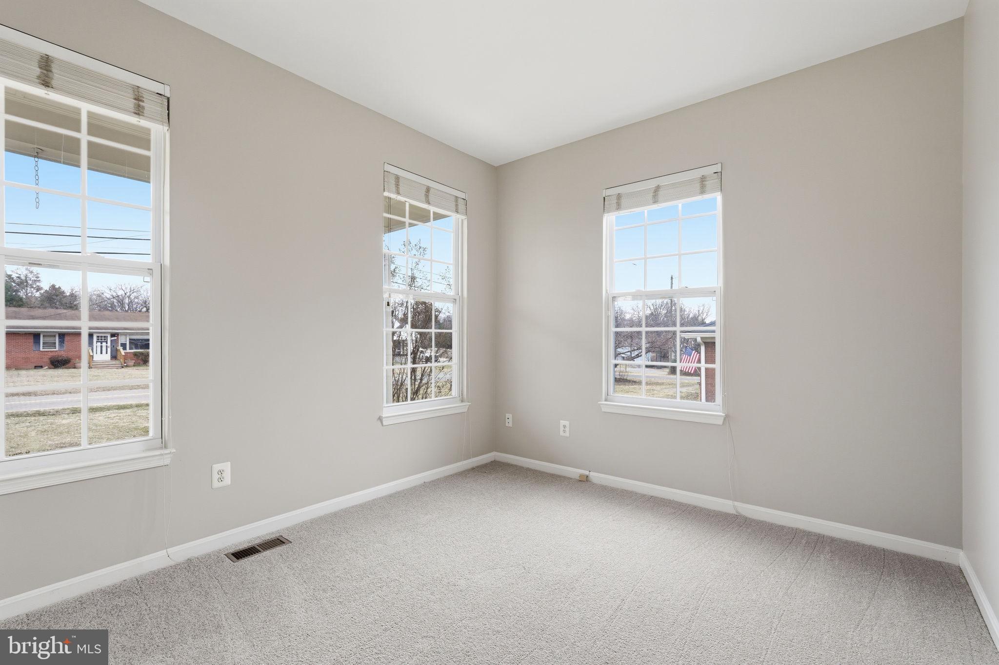 8310 Rolling Road Manassas, VA 20110 - Photo 16 of 58 a view of an empty room with a window