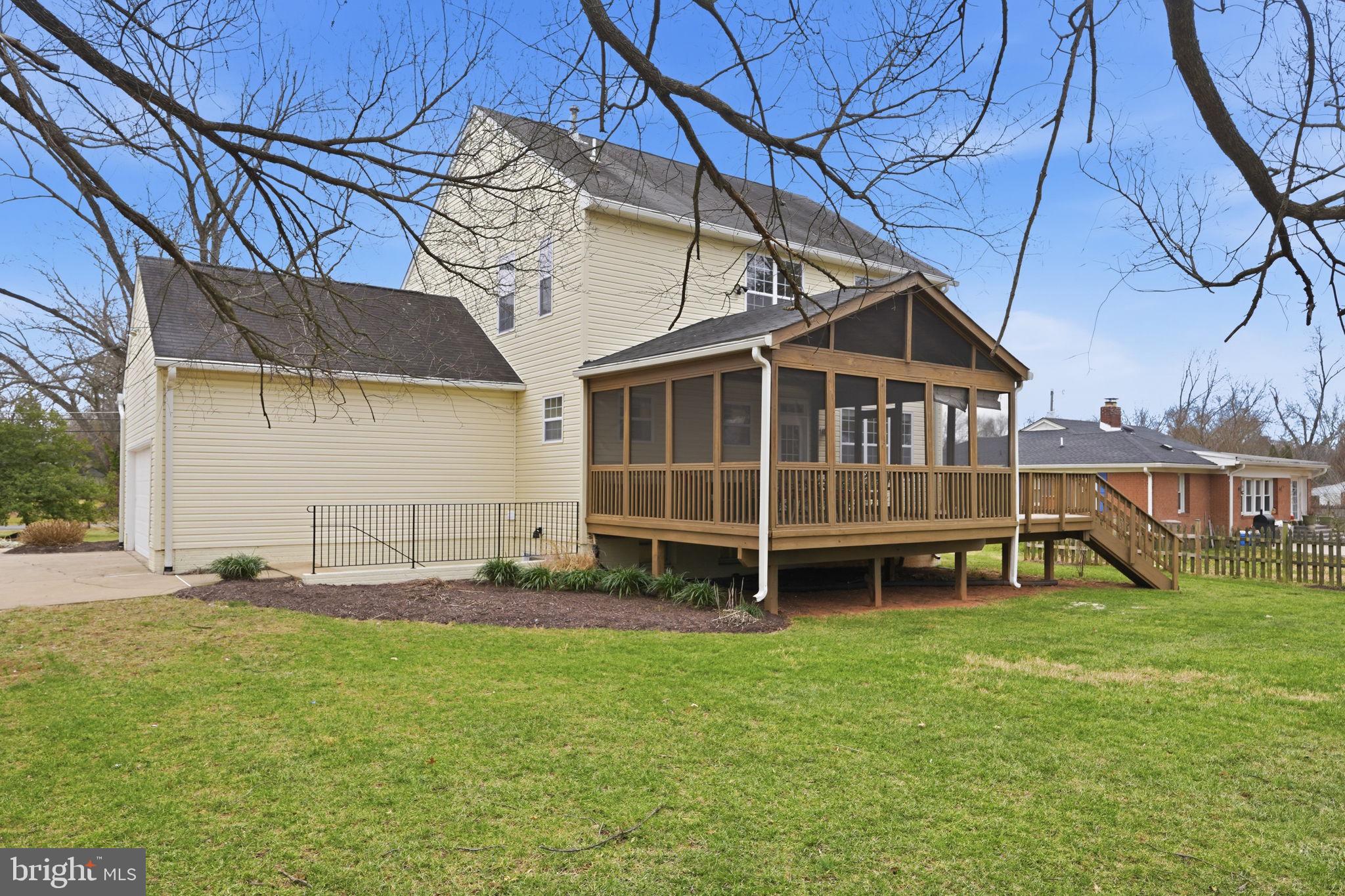 8310 Rolling Road Manassas, VA 20110 - Photo 2 of 58 a view of a house with a yard and sitting area