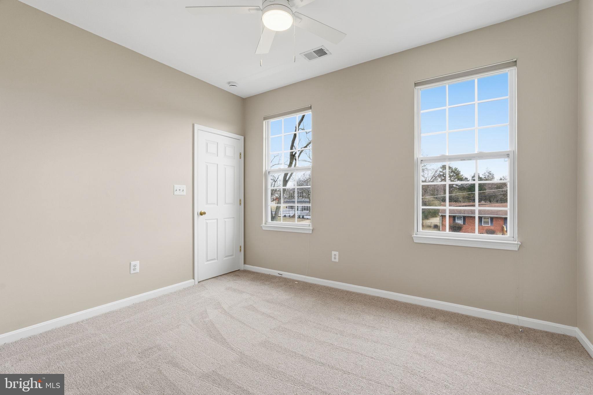 8310 Rolling Road Manassas, VA 20110 - Photo 27 of 58 an empty room with windows