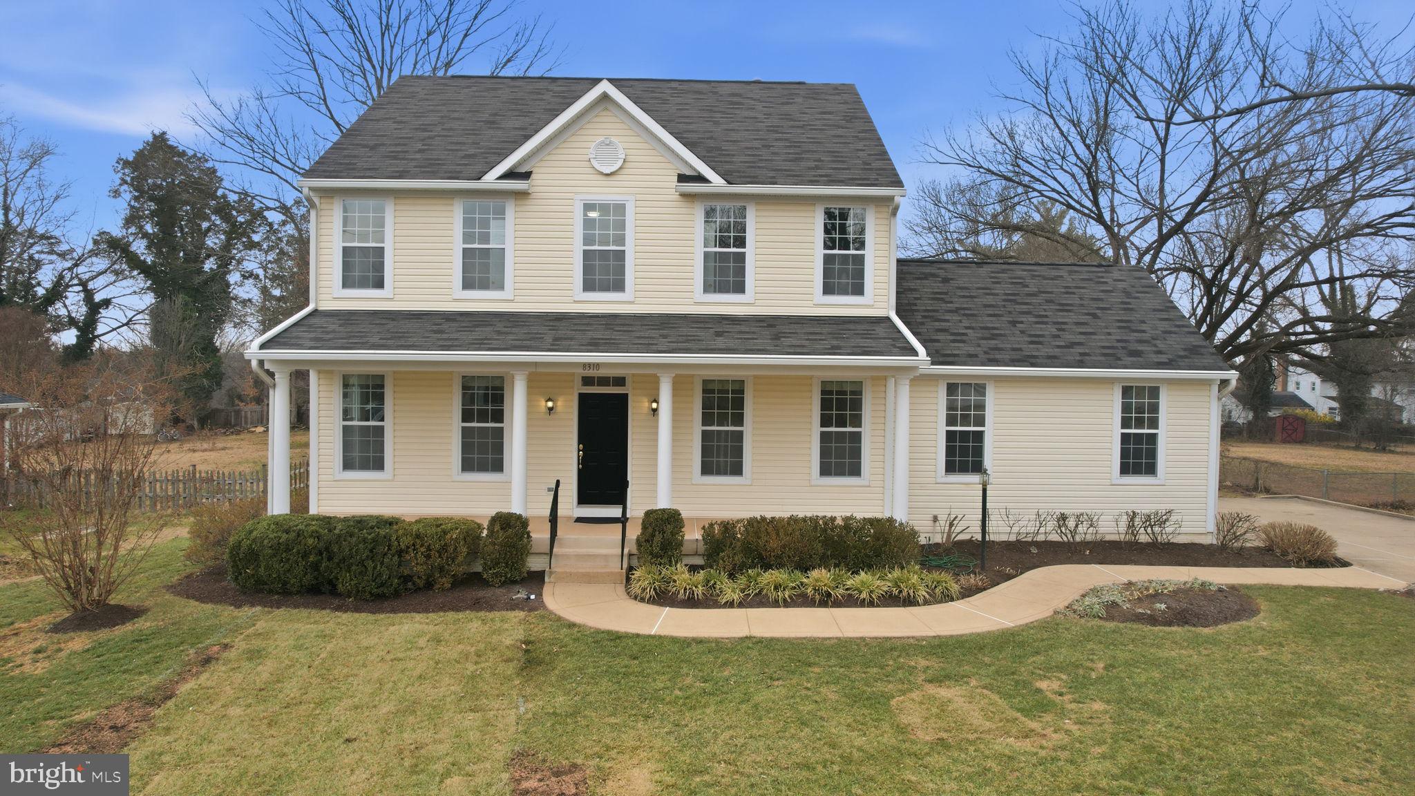 8310 Rolling Road Manassas, VA 20110 - Photo 3 of 58 a front view of a house with a yard