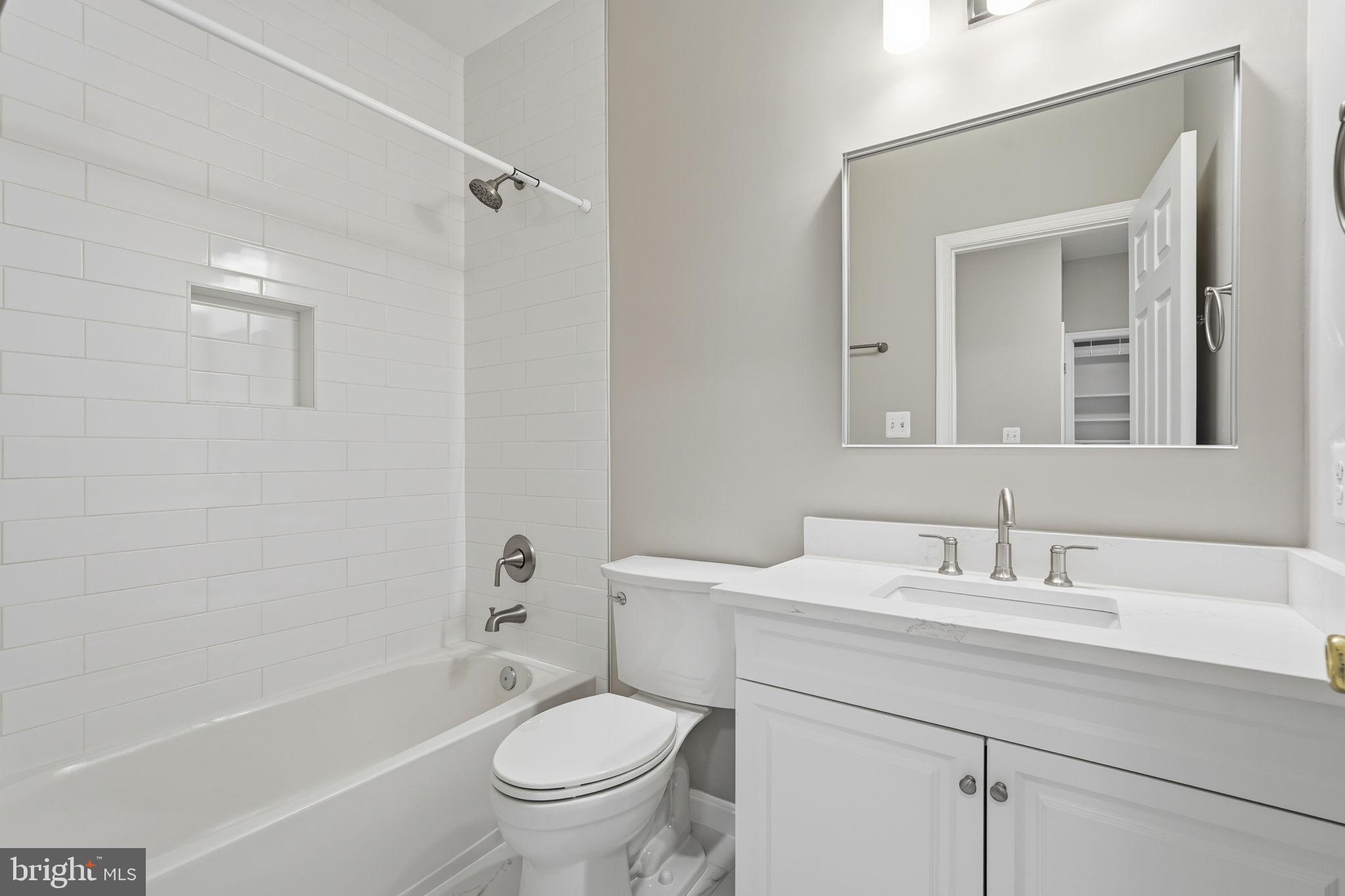 8310 Rolling Road Manassas, VA 20110 - Photo 30 of 58 a bathroom with a sink toilet and shower