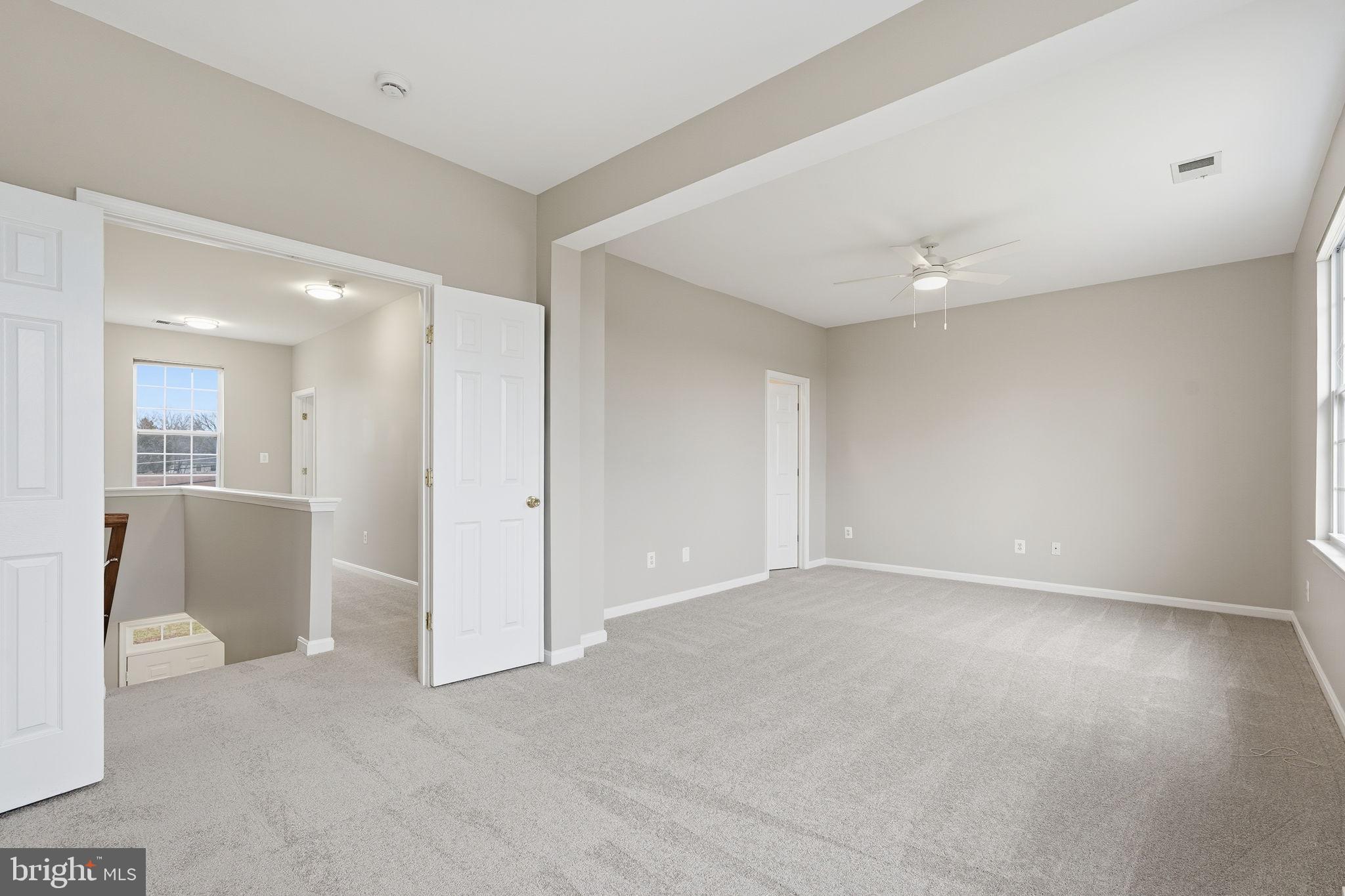 8310 Rolling Road Manassas, VA 20110 - Photo 31 of 58 a view of an empty room and a kitchen
