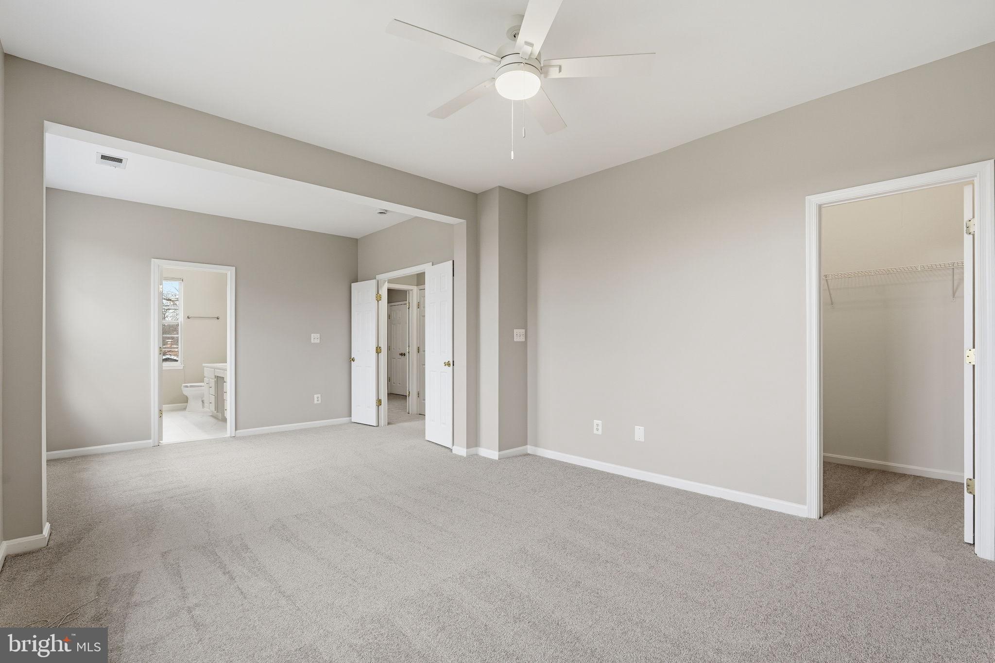 8310 Rolling Road Manassas, VA 20110 - Photo 33 of 58 an empty room with closet and a ceiling fan