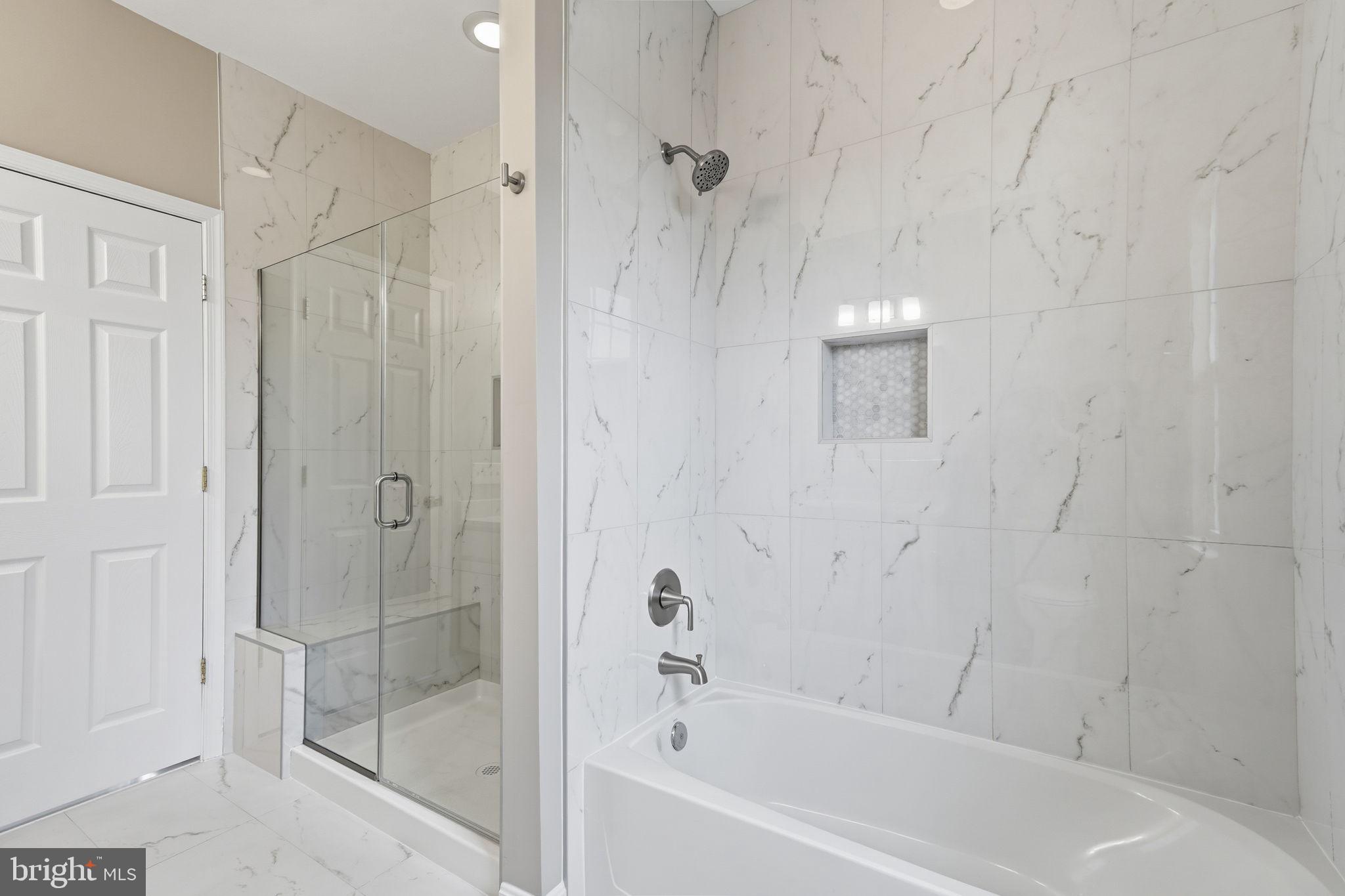8310 Rolling Road Manassas, VA 20110 - Photo 35 of 58 a bathroom with a bathtub