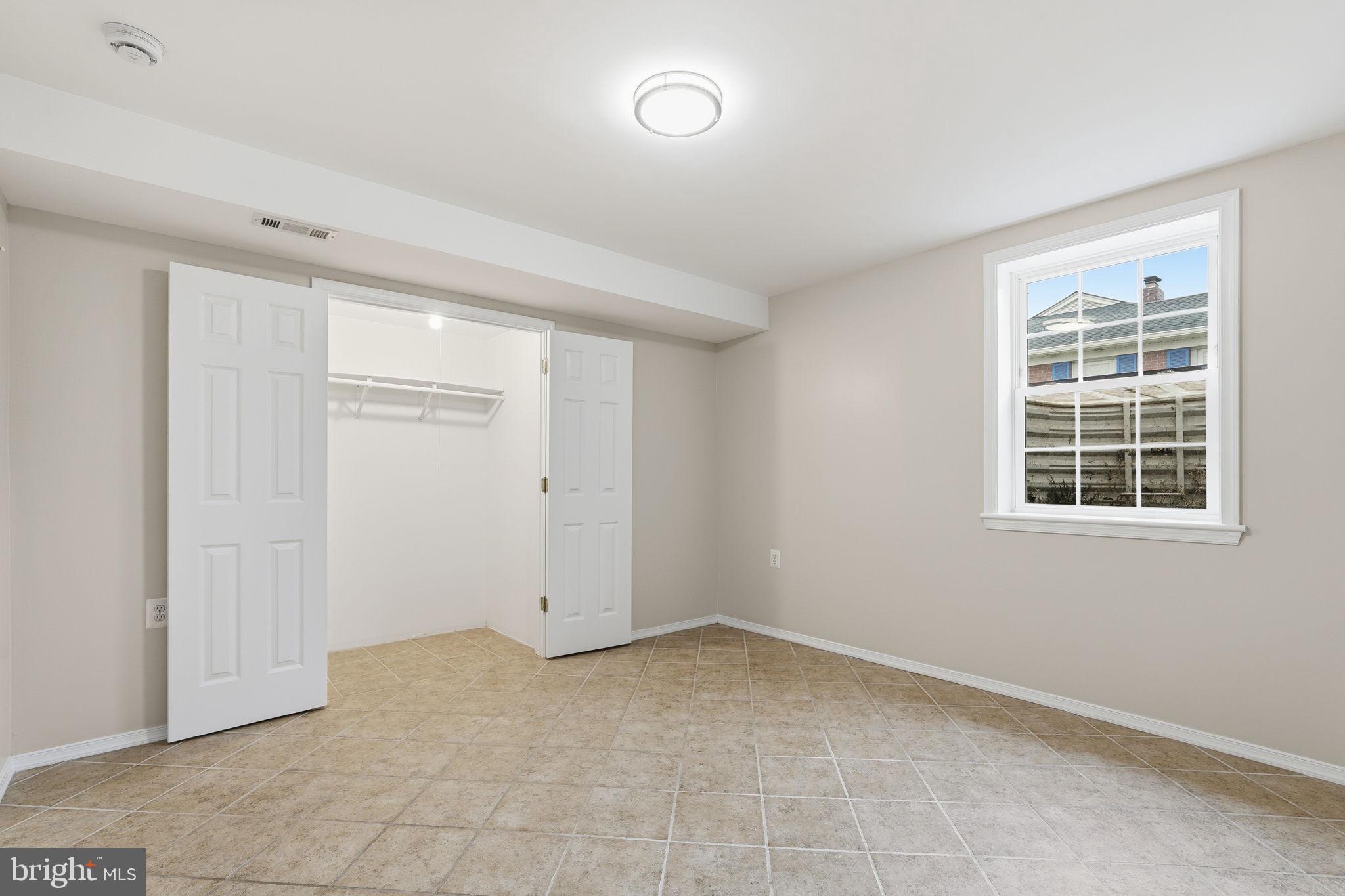 8310 Rolling Road Manassas, VA 20110 - Photo 38 of 58 an empty room with windows
