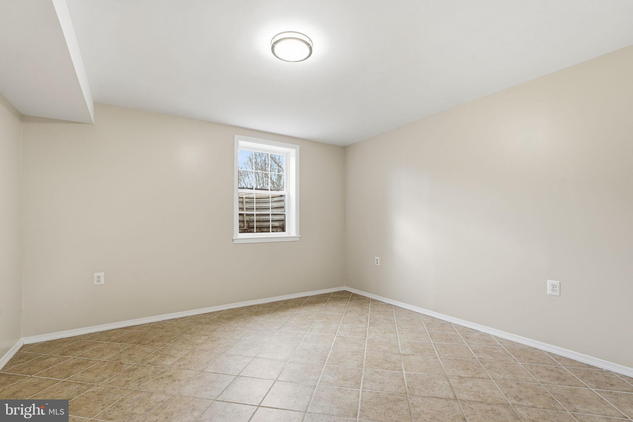 8310 Rolling Road Manassas, VA 20110 - Photo 39 of 58 an empty room with windows