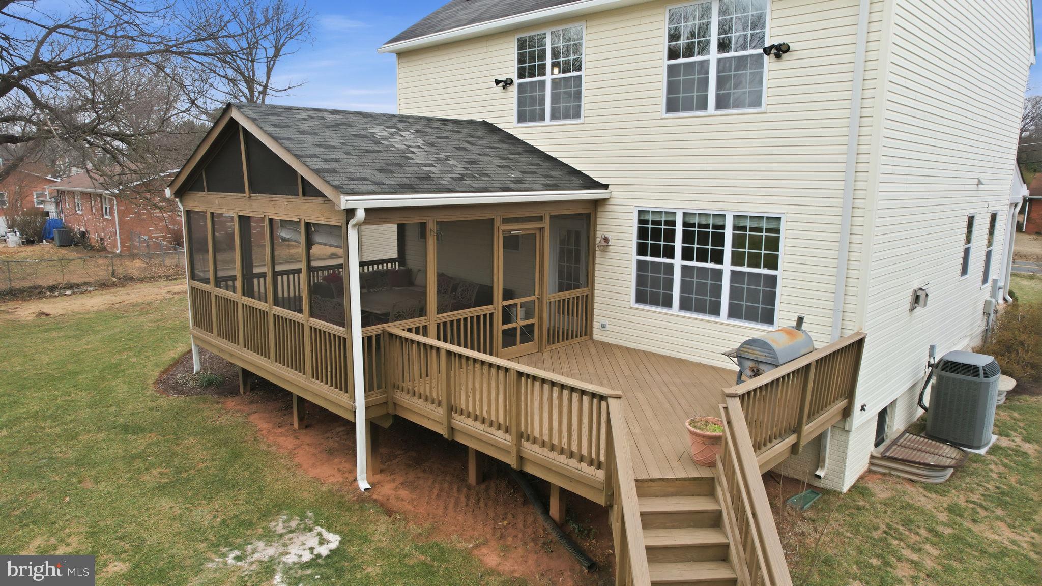8310 Rolling Road Manassas, VA 20110 - Photo 4 of 58 a view of a house with backyard and deck