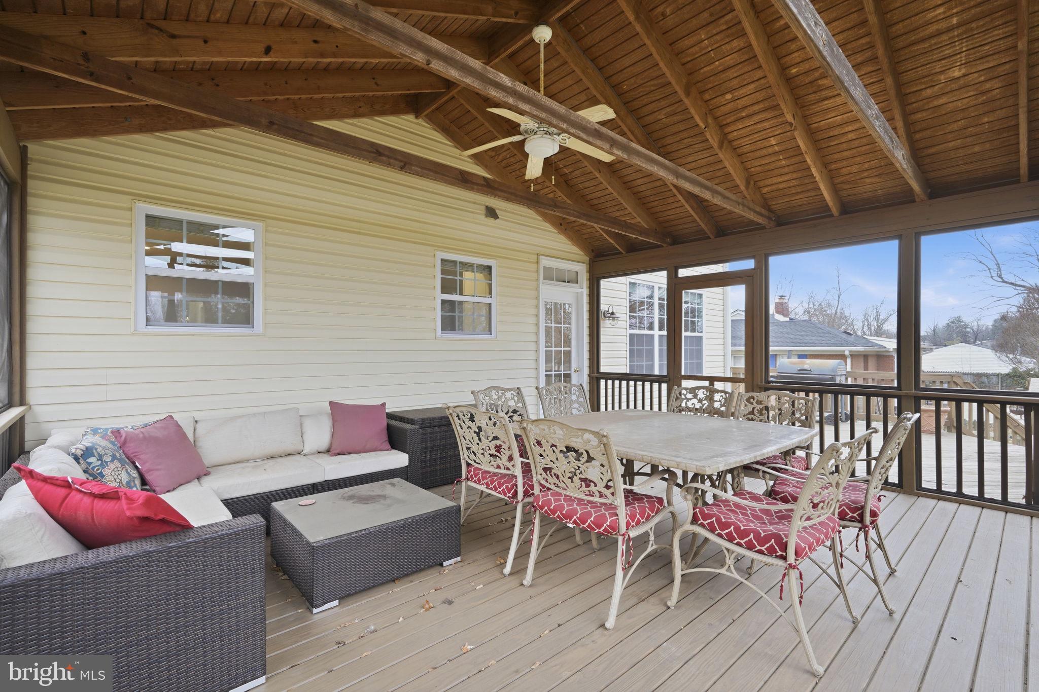 8310 Rolling Road Manassas, VA 20110 - Photo 9 of 58 a dining room with furniture and wooden floor
