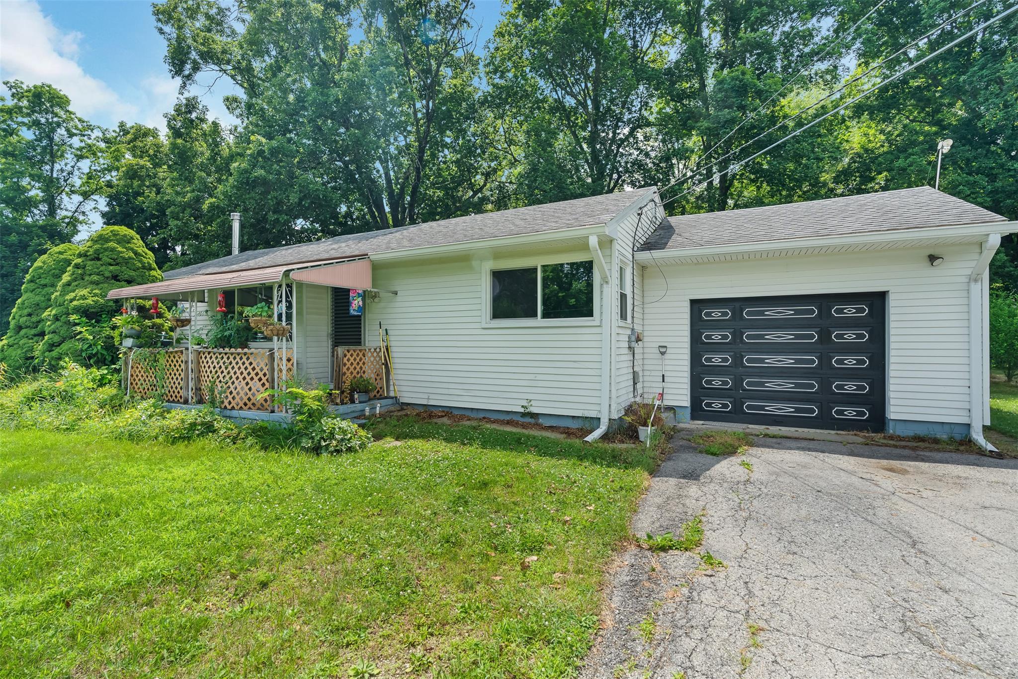 95 Van Vlack Road Hopewell Junction, NY 12533 - Photo 1 of 1 Ranch-style house featuring a garage, driveway, a front lawn, and a shingled roof