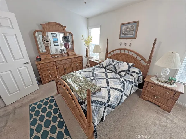 a bedroom with furniture and a window