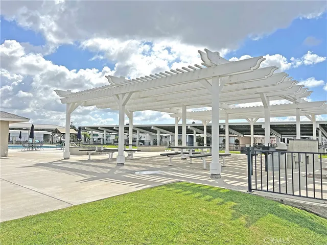 an outdoor view with swimming pool and outdoor seating