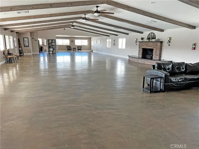a kitchen with stainless steel appliances granite countertop a refrigerator stove and sink