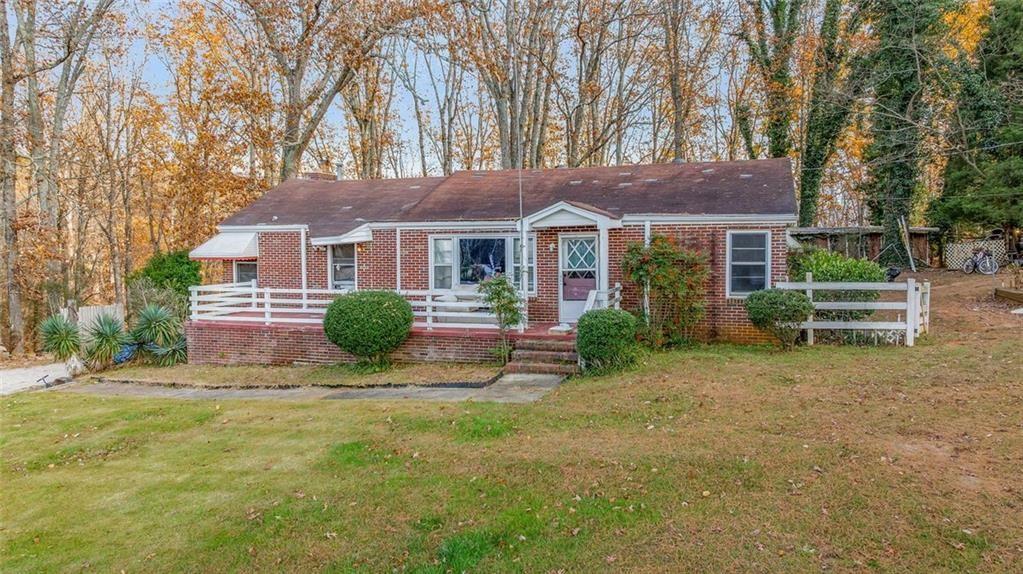 2626 White Sulphur Road Gainesville, GA 30501 - Photo 2 of 20 front view of a house with a yard